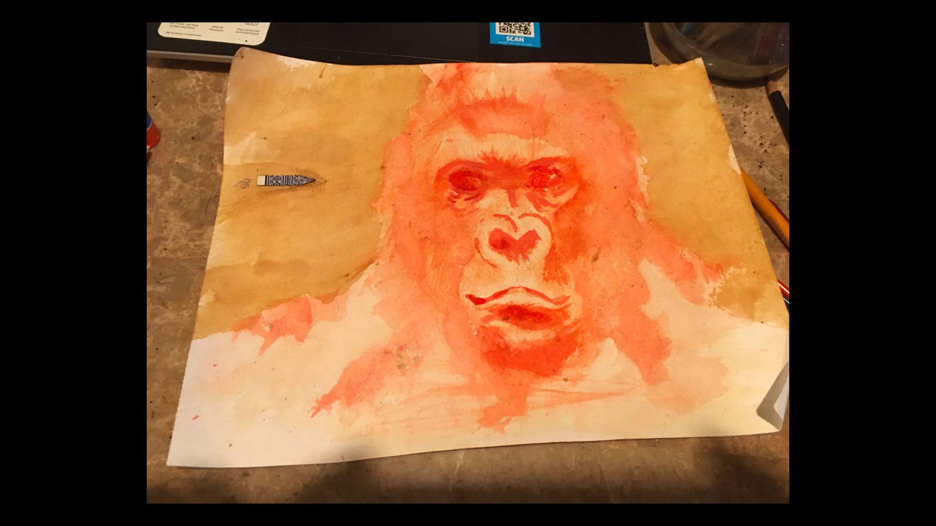 Watercolor of a gorilla done with coffee grounds and chili powder.