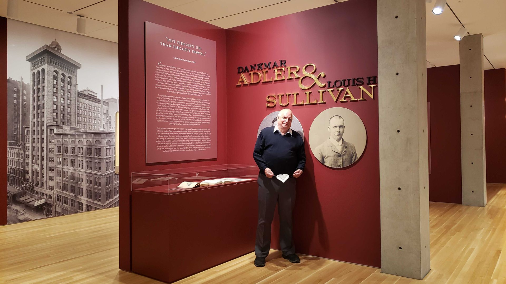 Man in front of art exhibition