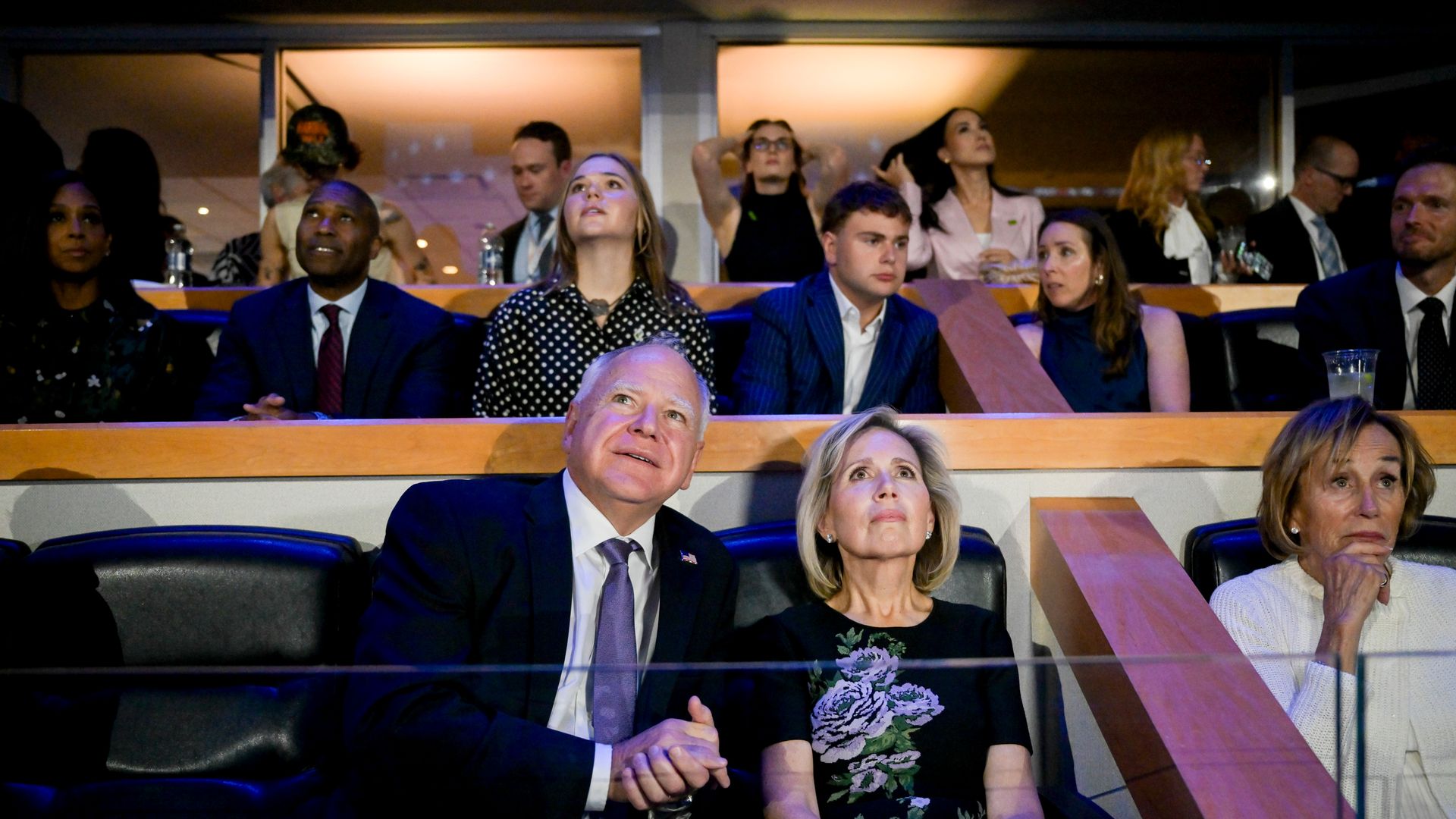 Tim Walz, governor of Minnesota and Democratic vice-presidential nominee, left, and Gwen Walz, wife of Tim Walz, during the Democratic National Convention (DNC) at the United Center in Chicago, Illinois, US, on Monday, Aug. 19, 2024