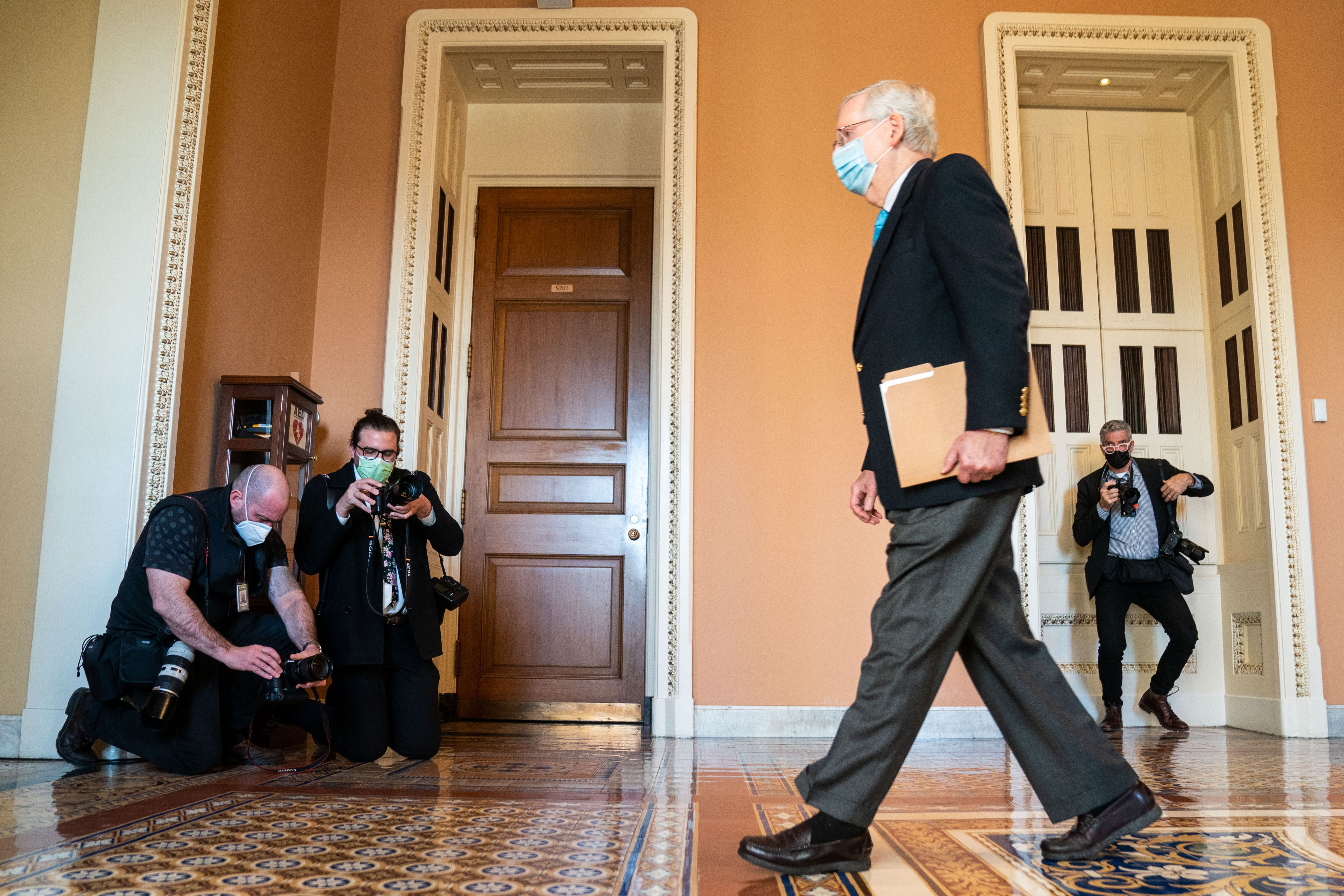 Senate Minority Leader Mitch McConnell is seen walking through the Capitol halls on Monday.