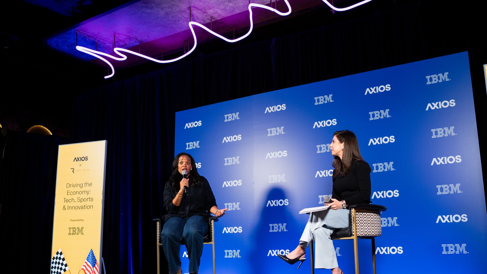 Danita Johnson on stage in conversation with Sara Fischer.
