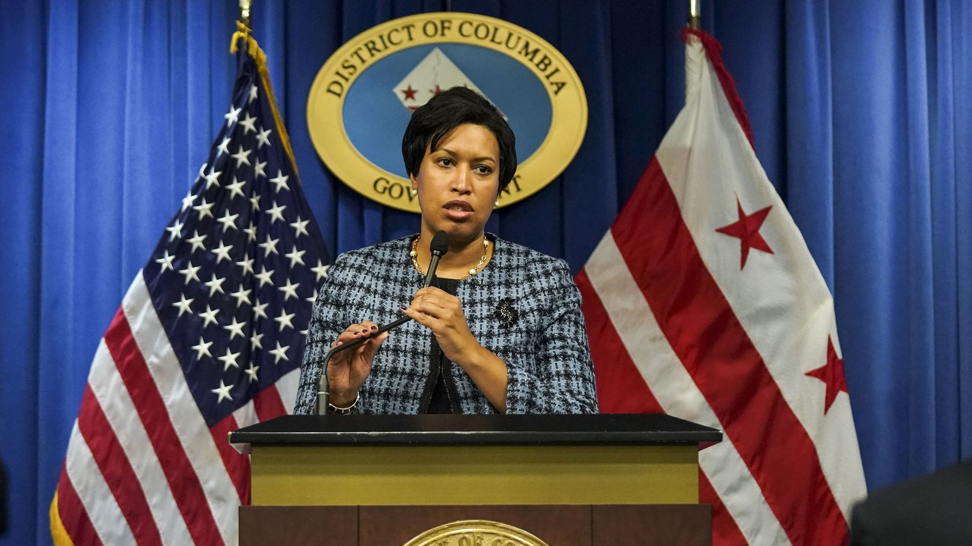 DC mayor Muriel Bowser speaks at a podium
