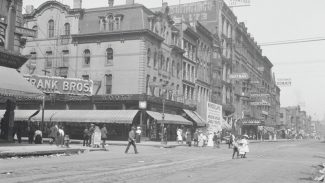 GIF of an old street corner morphing into present day. 