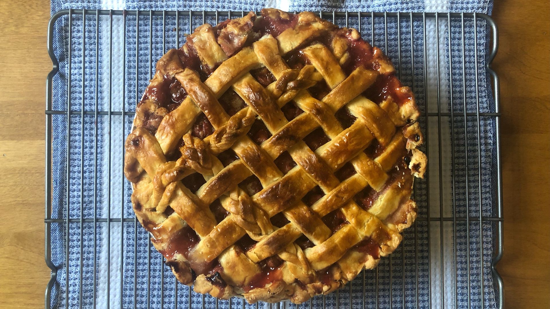 A strawberry-rhubarb pie with a lattice crust on top.