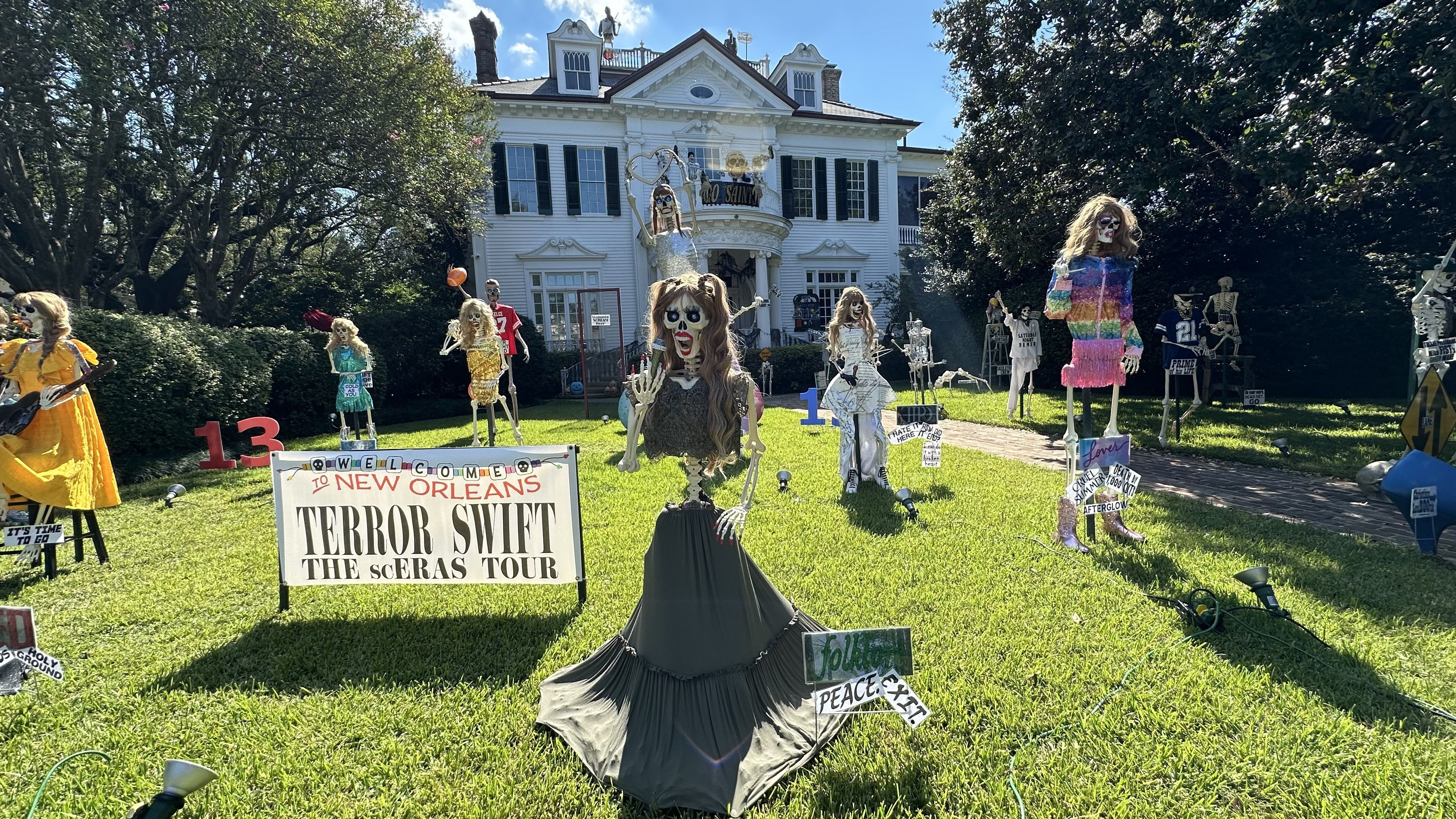 Skeletons dressed like Taylor Swift stand next to a sign that says "Terror Swift: The scERAS Tour."