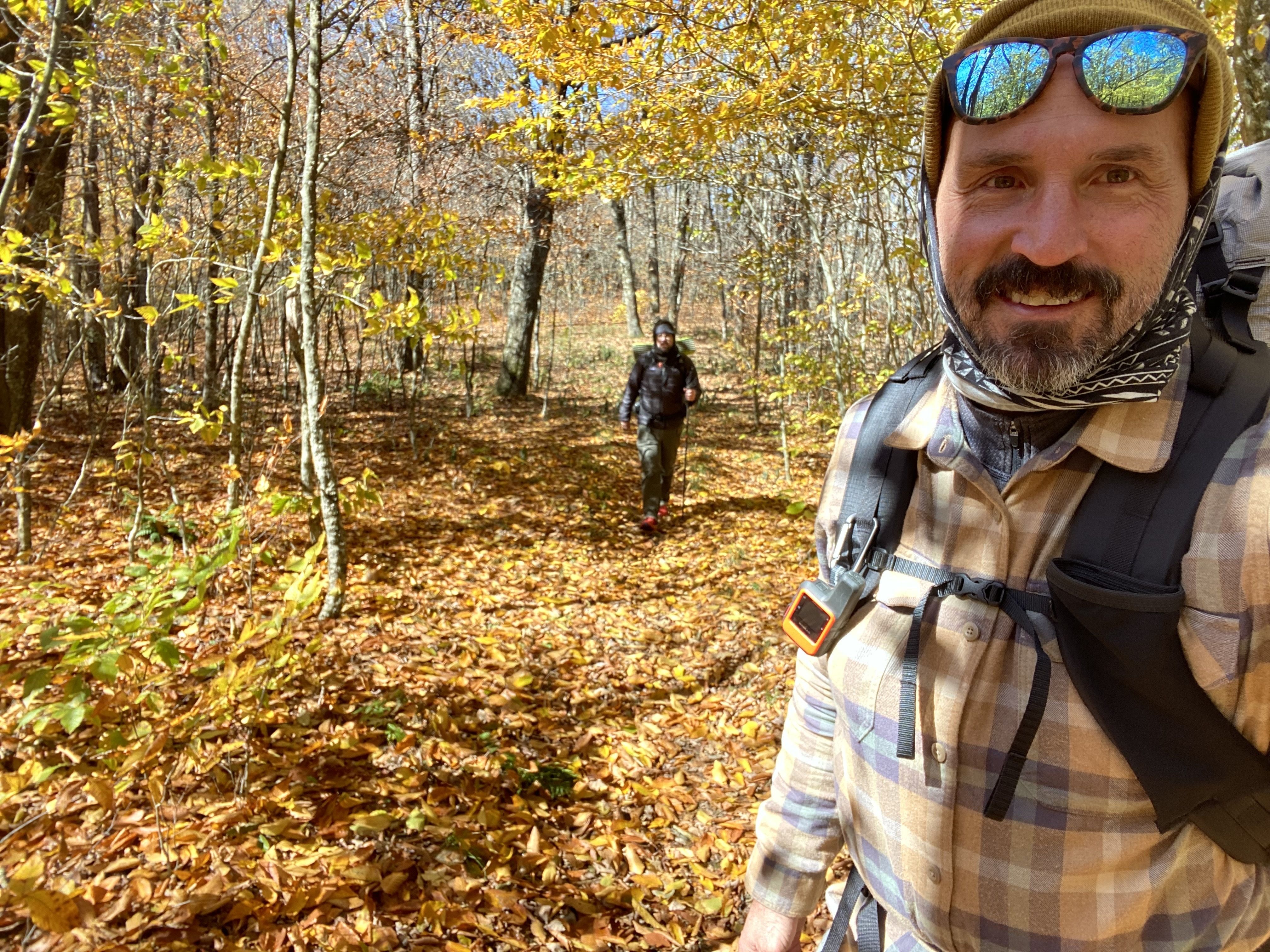 Ben Montgomery and friend hiking the appalachian trail through glorious leaves.