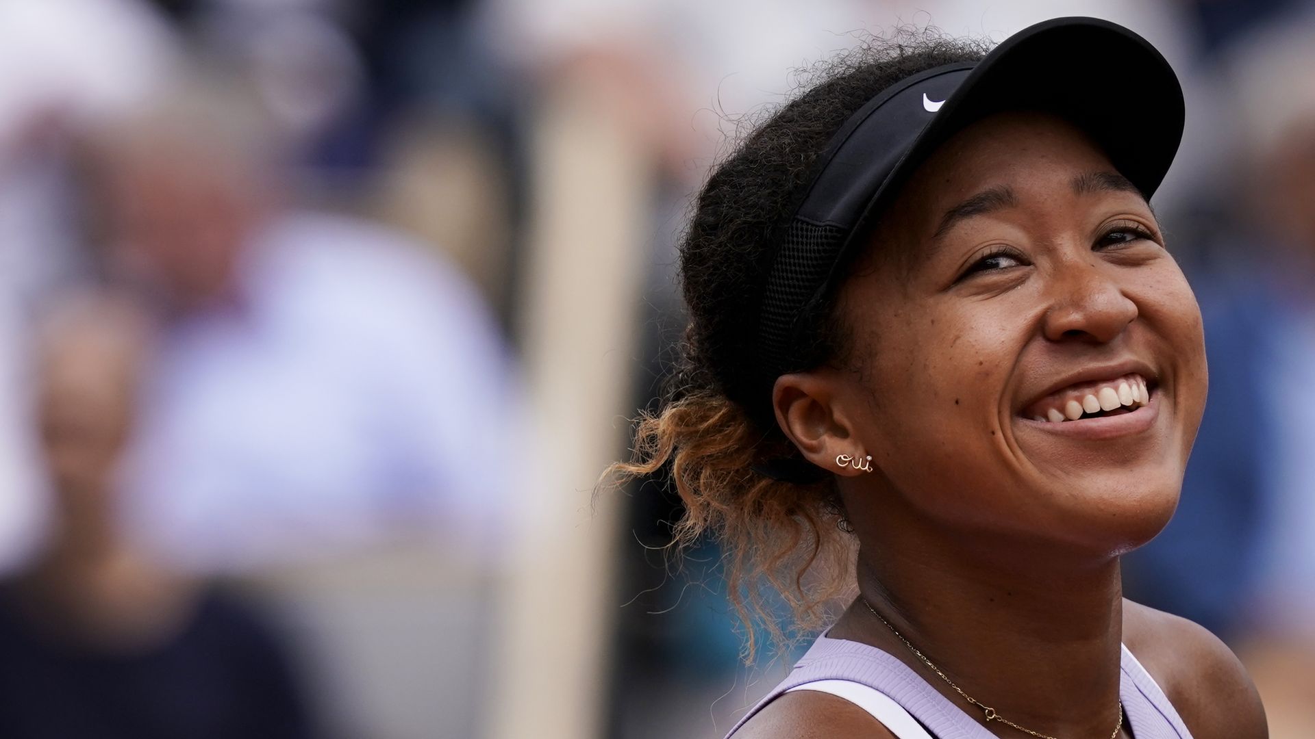 A photo of a smiling Naomi Osaka.