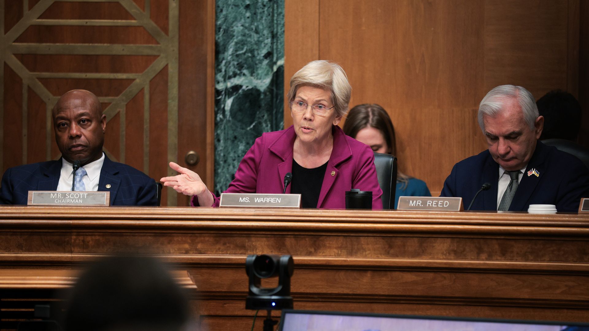 Senators Tim Scott (R-SC), Elizabeth Warren (D-MA) and Jack Reed (D-RI) at a Senate Banking Committee hearing in February.