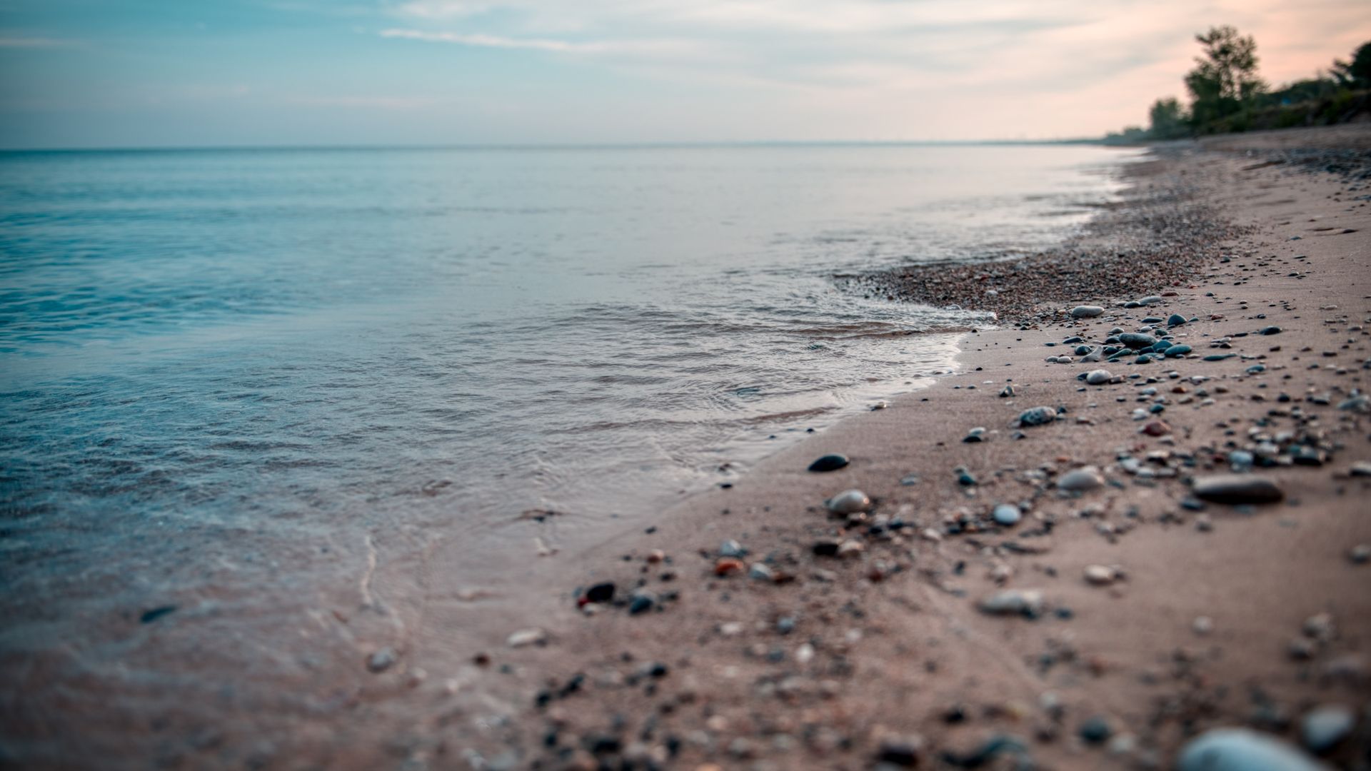 A calm beach on the lakefront.