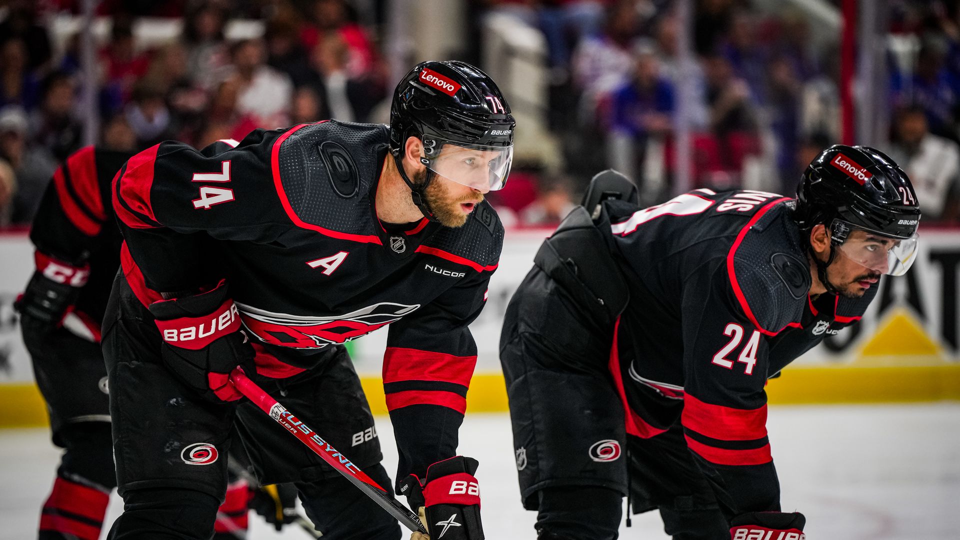 RALEIGH, NORTH CAROLINA - MAY 11: Jaccob Slavin #74 and Seth Jarvis #24 get set for a face-off against the New York Rangers during the second period in Game Four of the Second Round of the 2024 Stanley Cup Playoffs at PNC Arena on May 11, 2024 in Raleigh, North Carolina. (Photo by Josh Lavallee/NHLI