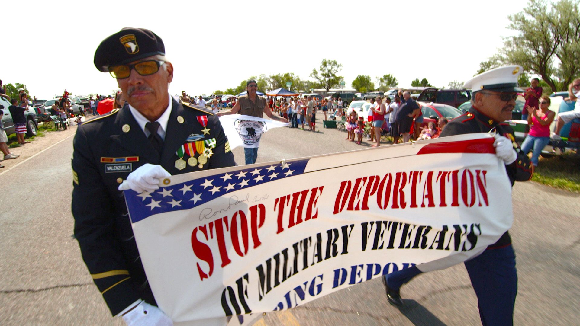 Valente and Manuel Valenzuela marching in the July 4 th parade in Pueblo, Colo.