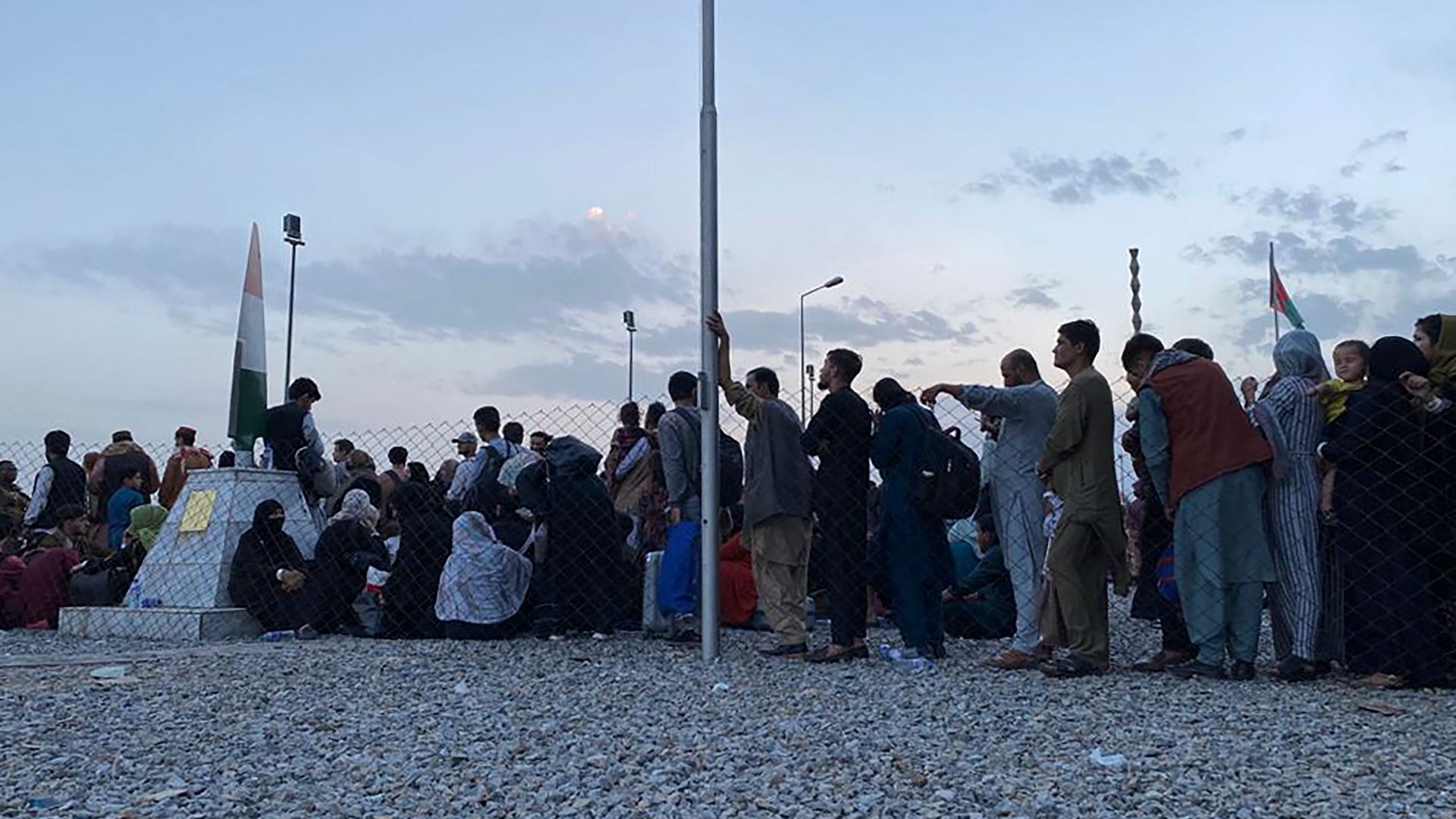 Photo of a line of people waiting outside