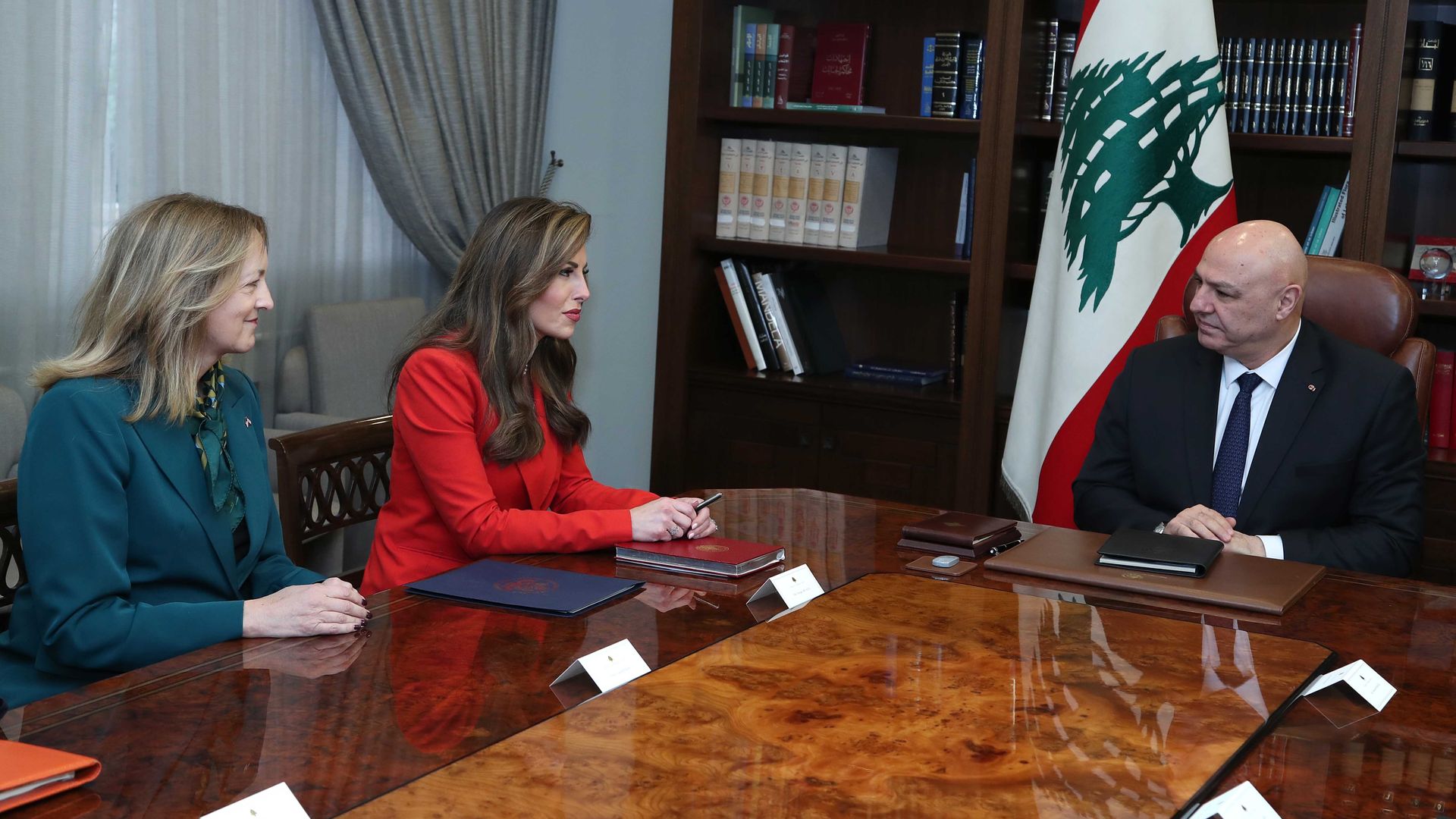 Three people sitting at a table