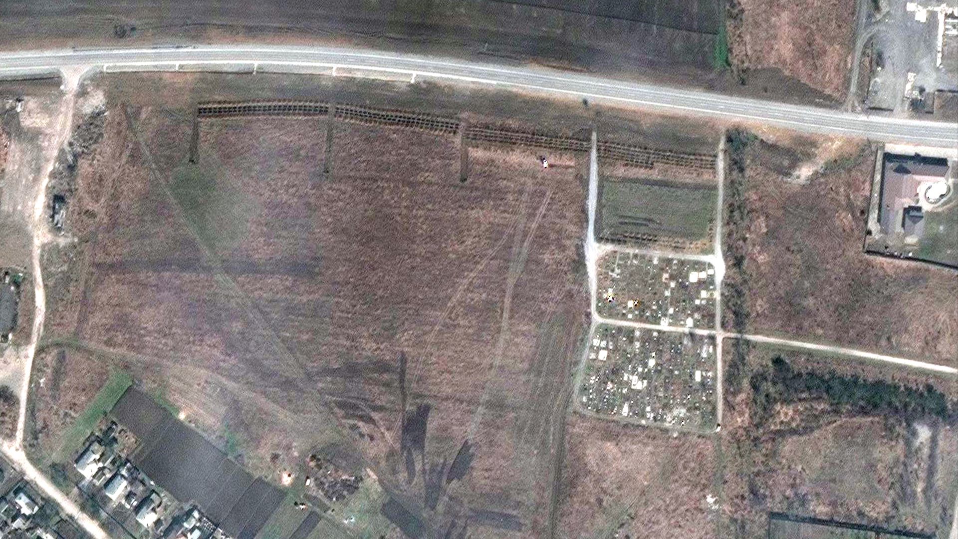 A satellite image showing a mass grave site near an existing graveyard in the village of Manhush, Ukraine, situated roughly 12 miles from Mariupol.