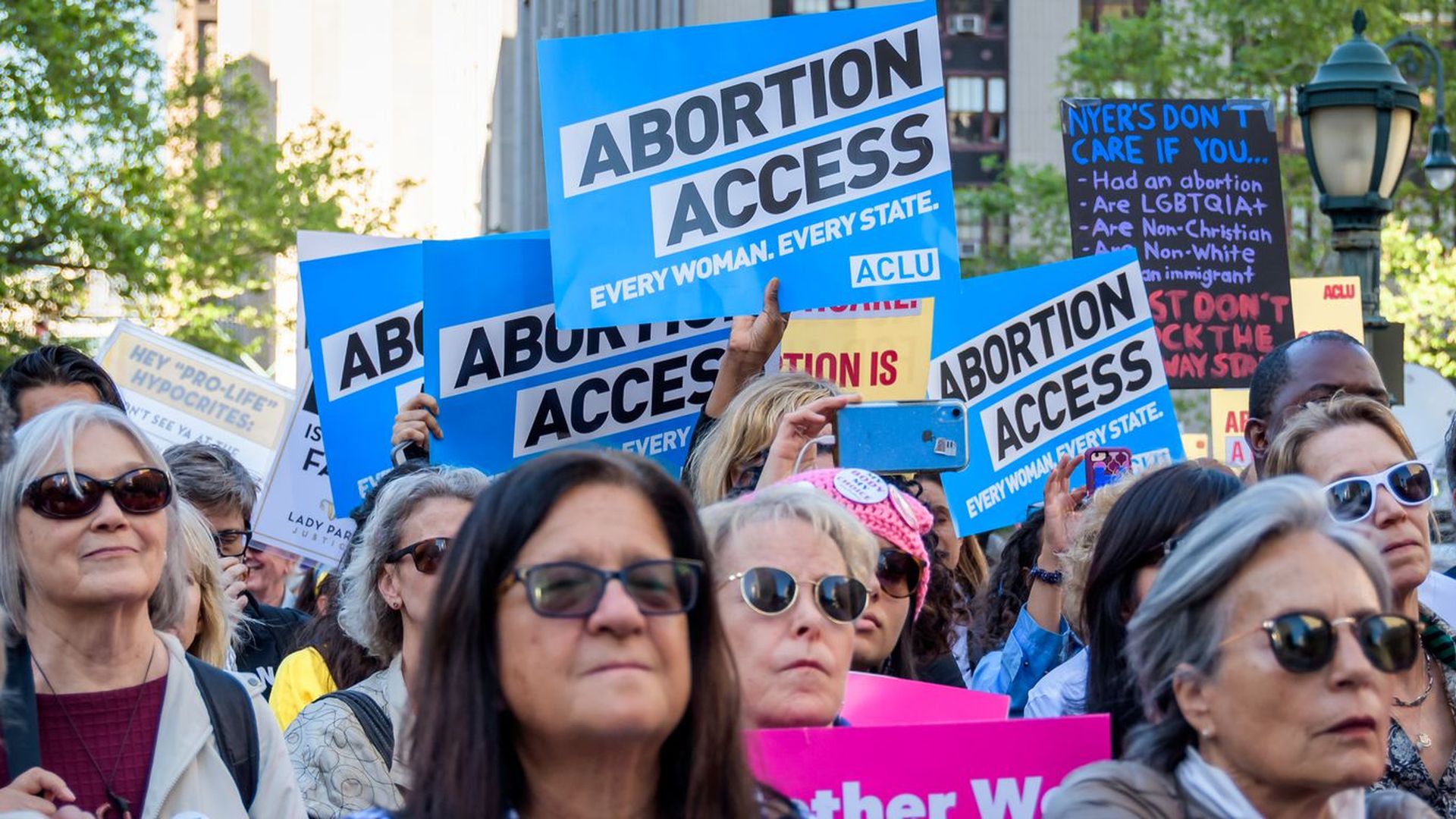 Pro-abortion rights protesters rally.