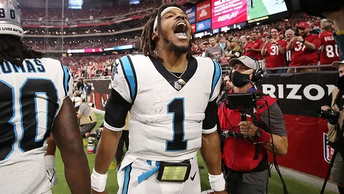 Cam Newton shouts to the crowd after scoring a touchdown in his return to the Panthers. Photo: Christian Petersen/Getty Images