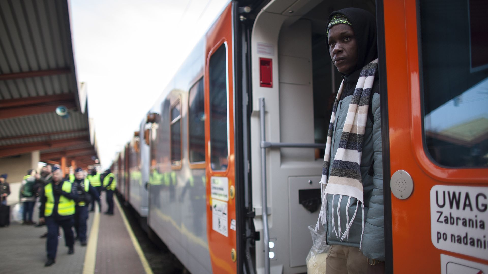 A Ukrainian refugee arrives by train in Poland