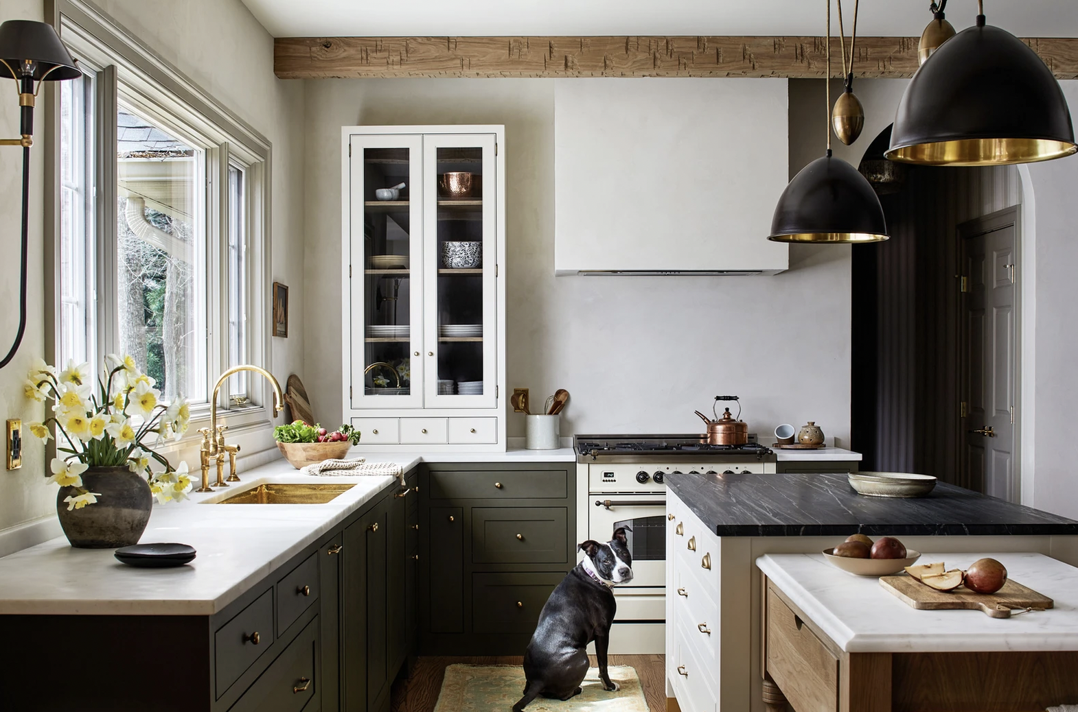 Green cabinets, a creamy white island, contrasting counters and a built-in prep station keep Tanya Smith-Shiflett's personal kitchen fresh and modern. Photo: Stacy Zarin Goldberg