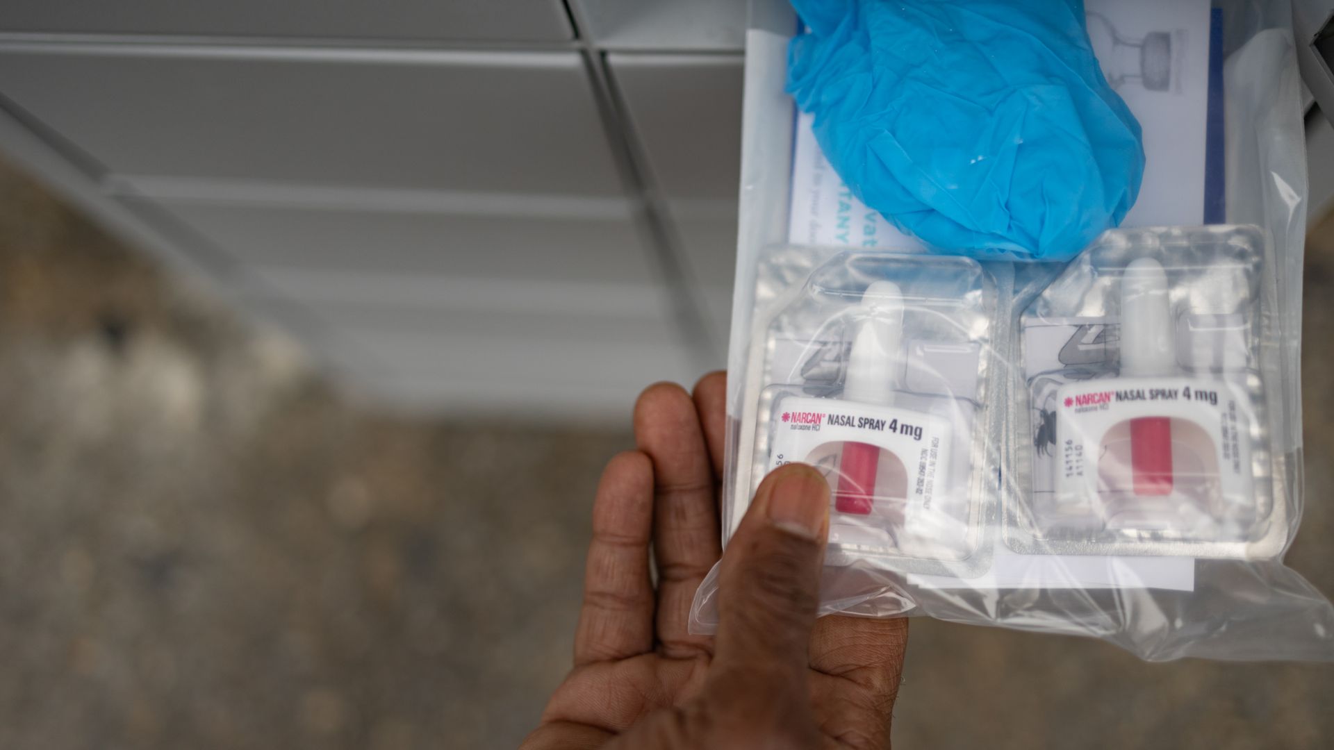A person handling a naloxone kit in Philadelphia in February 2022.