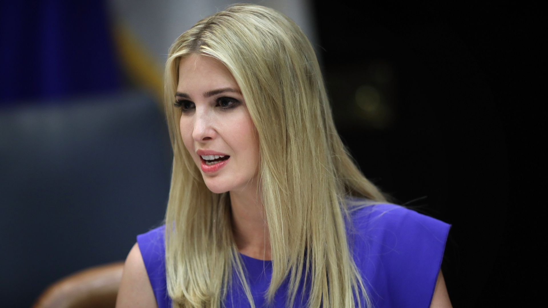 Ivanka Trump speaks at a table