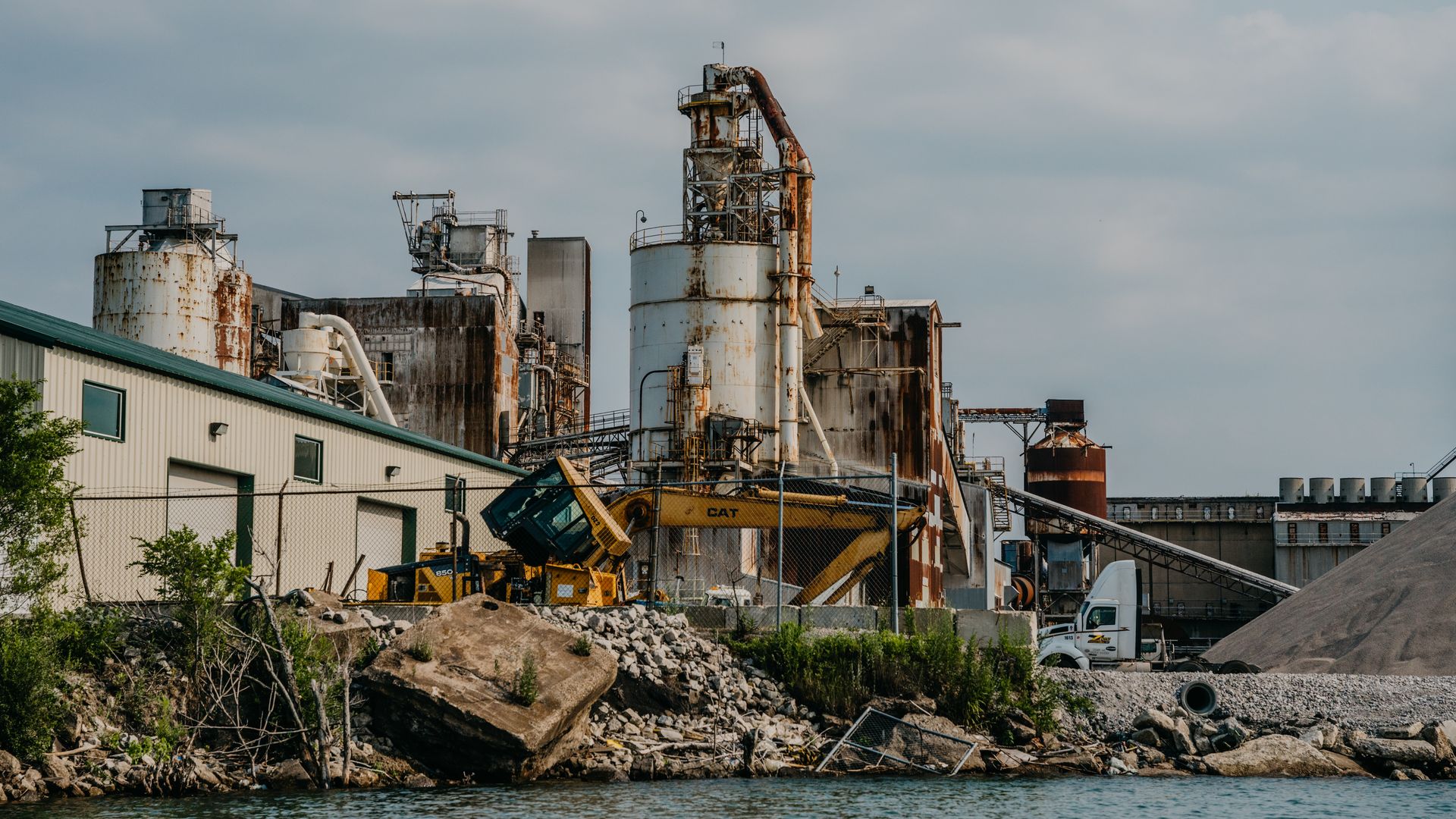 Photo of a factory on a river.
