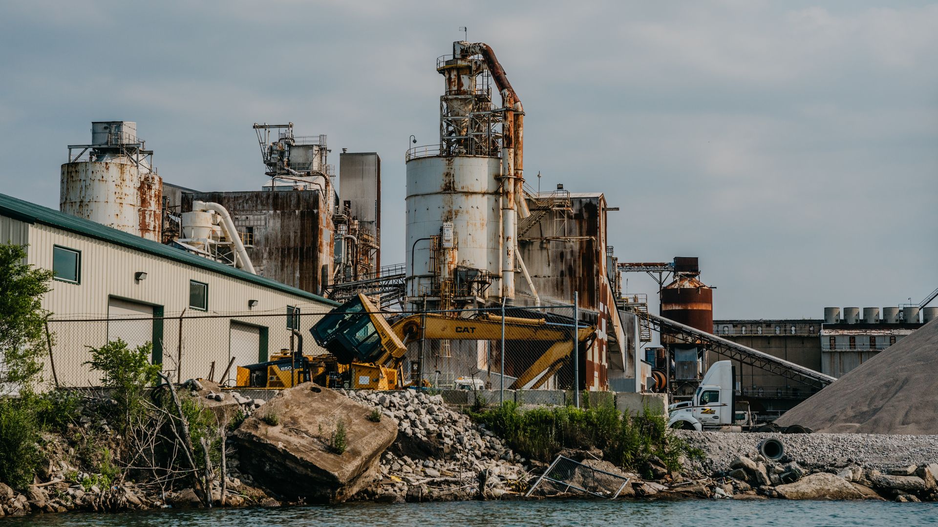 Photo of a factory on a river. 