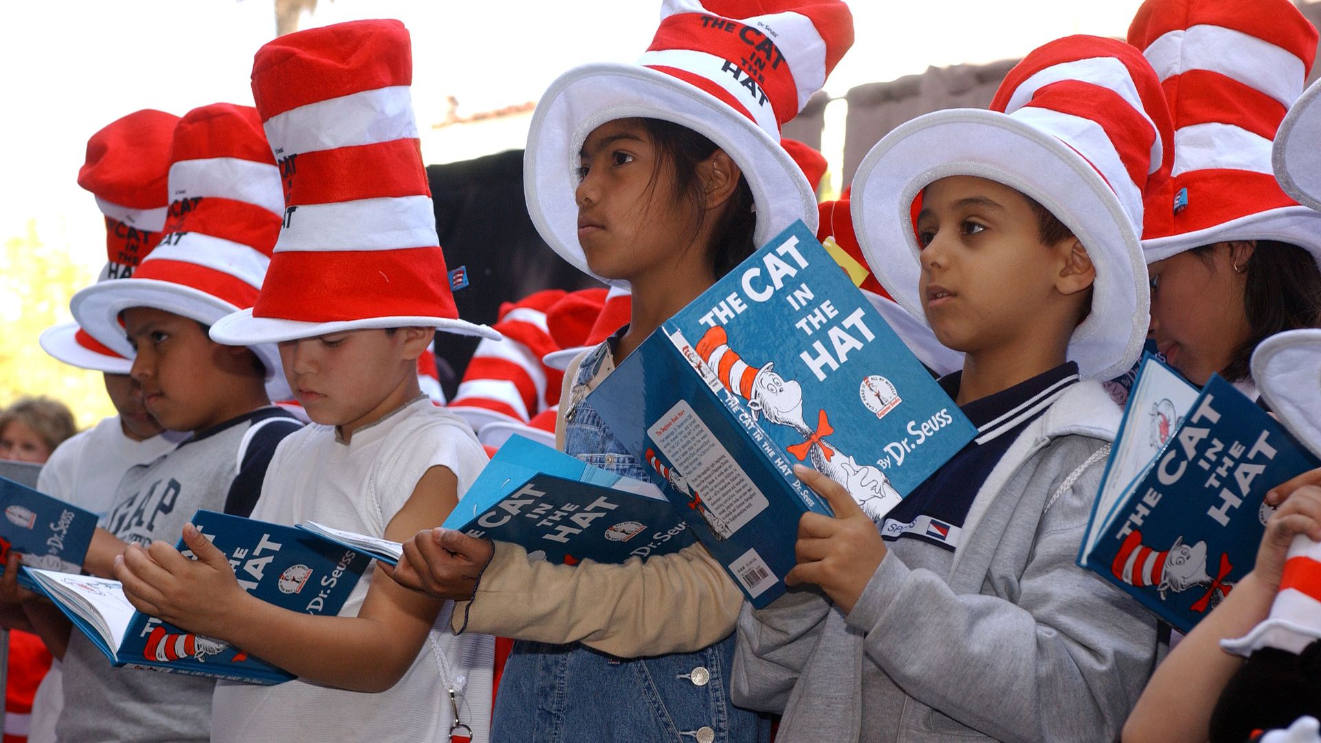 Photo of children reading "The Cat in the Hat"