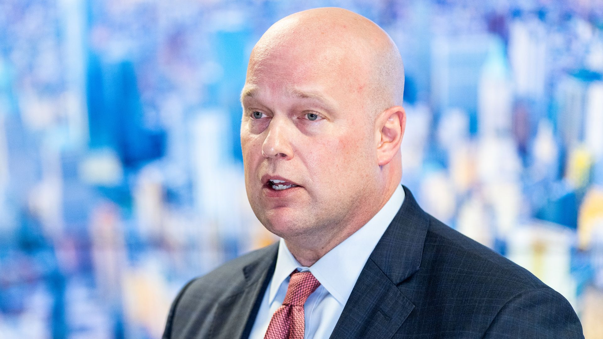 Matt whitaker in a suit and tie