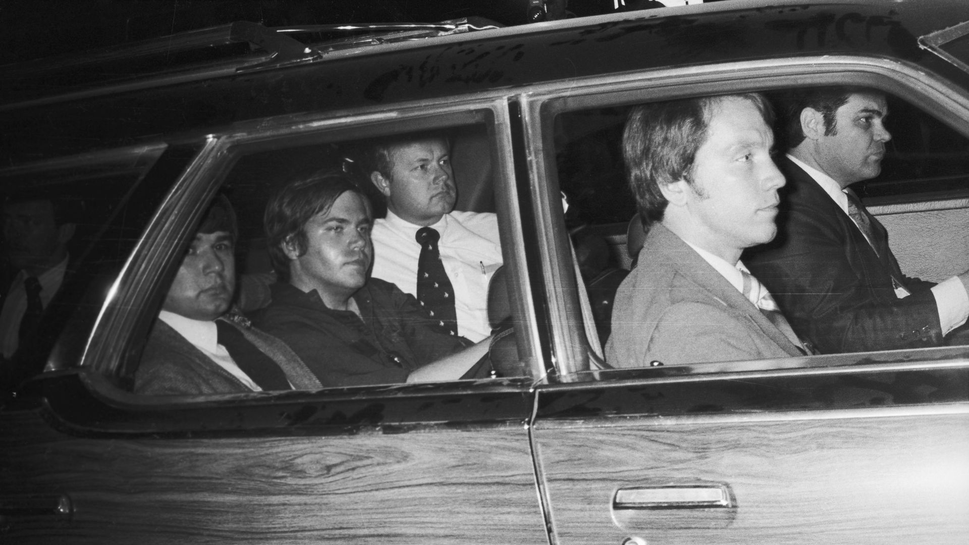 Picture of John Hinckley sitting in the back of a car