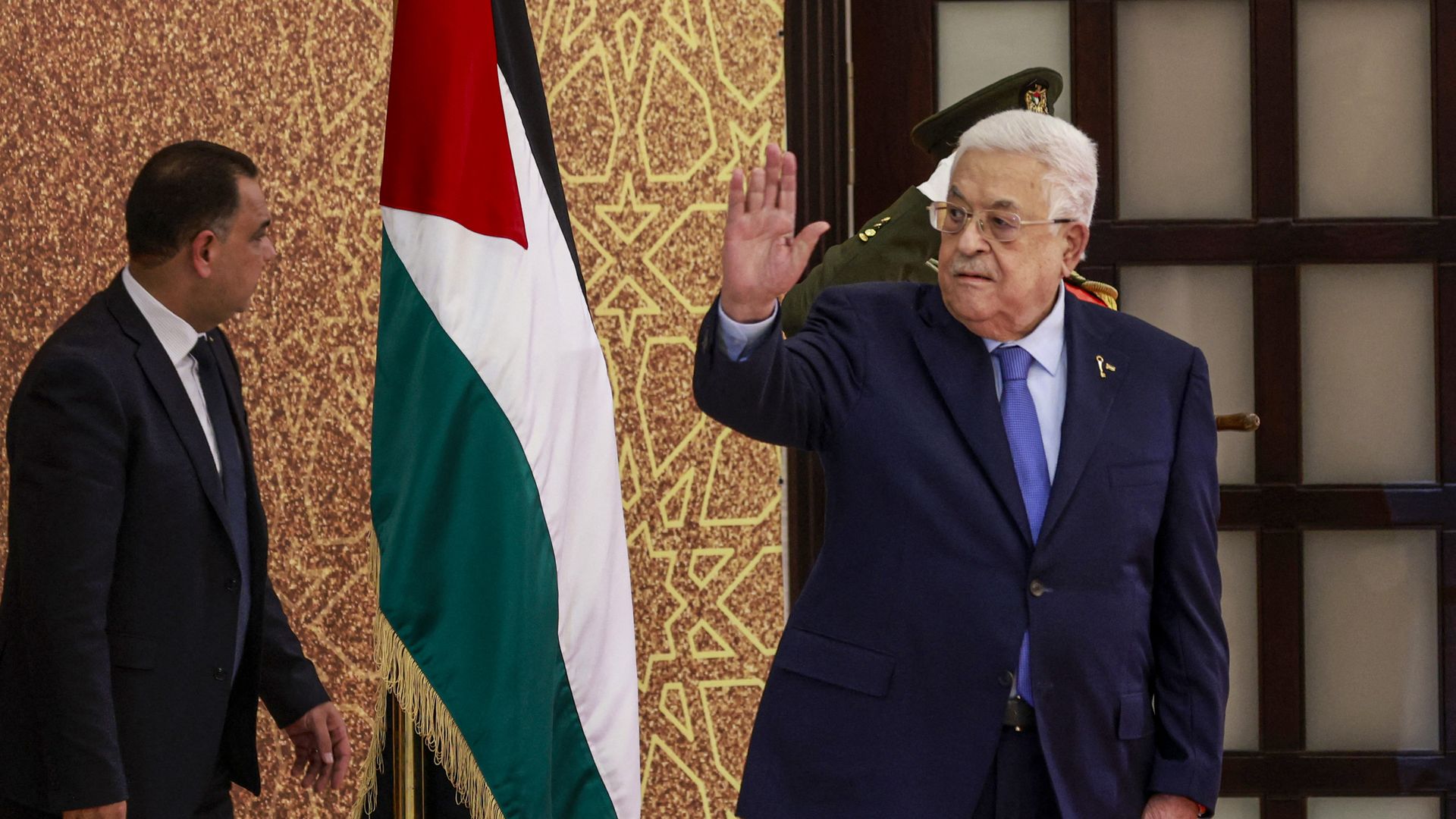Palestinian Authority President Mahmud Abbas waves during a swearing in ceremony of mewly-appointed ministers, on March 31, 2024, in Ramallah, in the occupied West Bank. 
