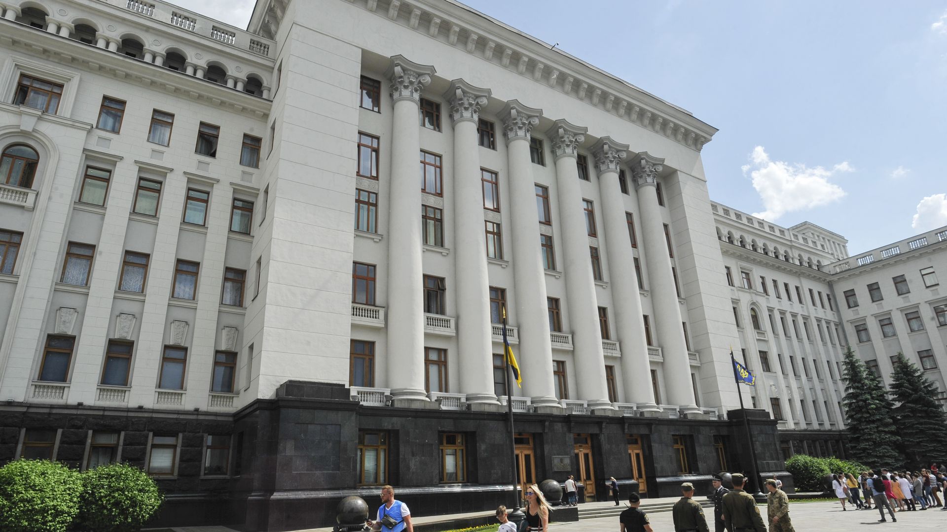People walking past Ukraine's Presidential Office Building in Kyiv in 2019.