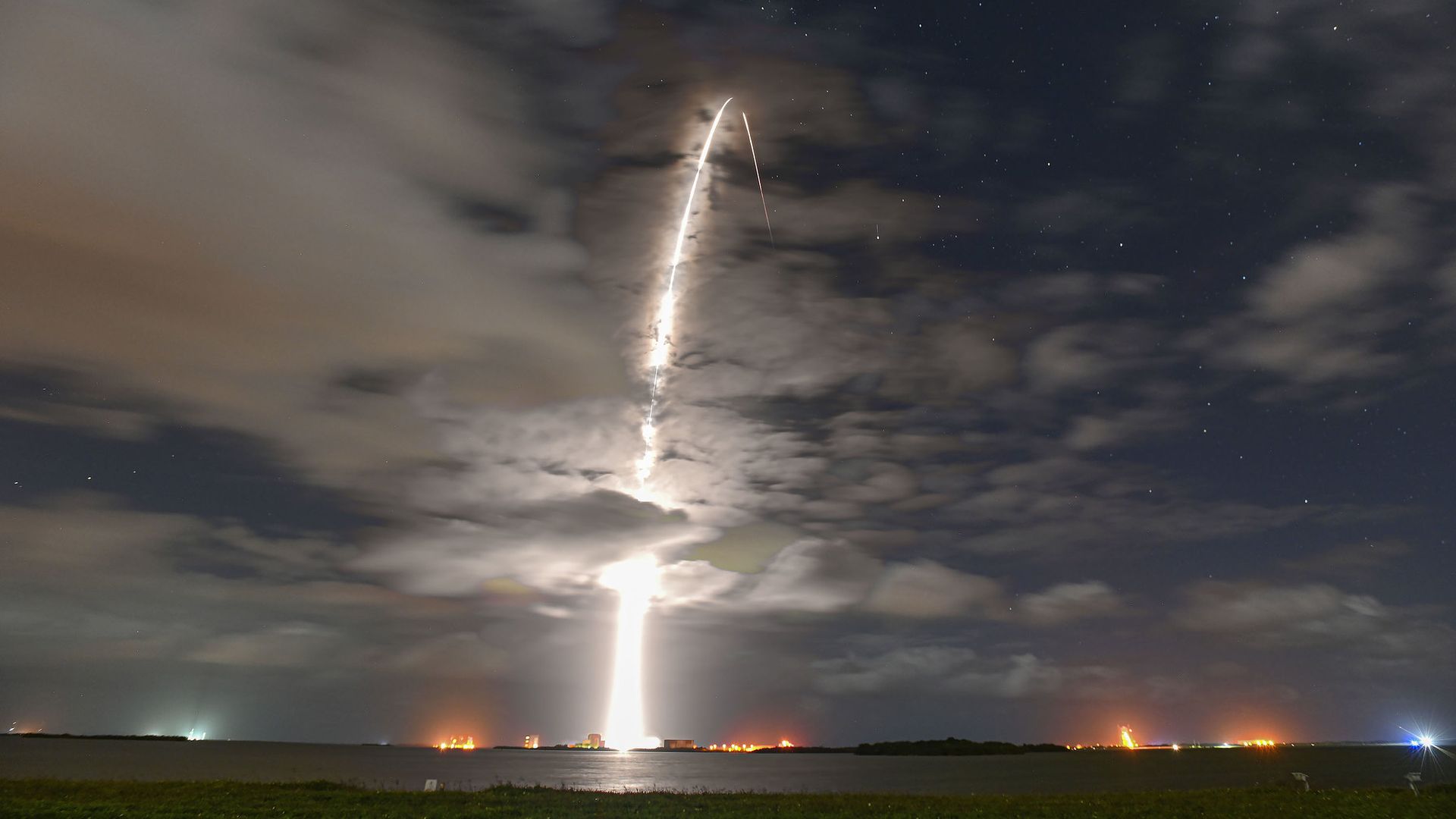 The streaking light of a SpaceX rocket launching at night