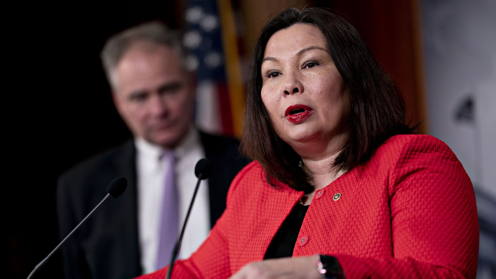 Photo of Tammy Duckworth speaking from behind a podium