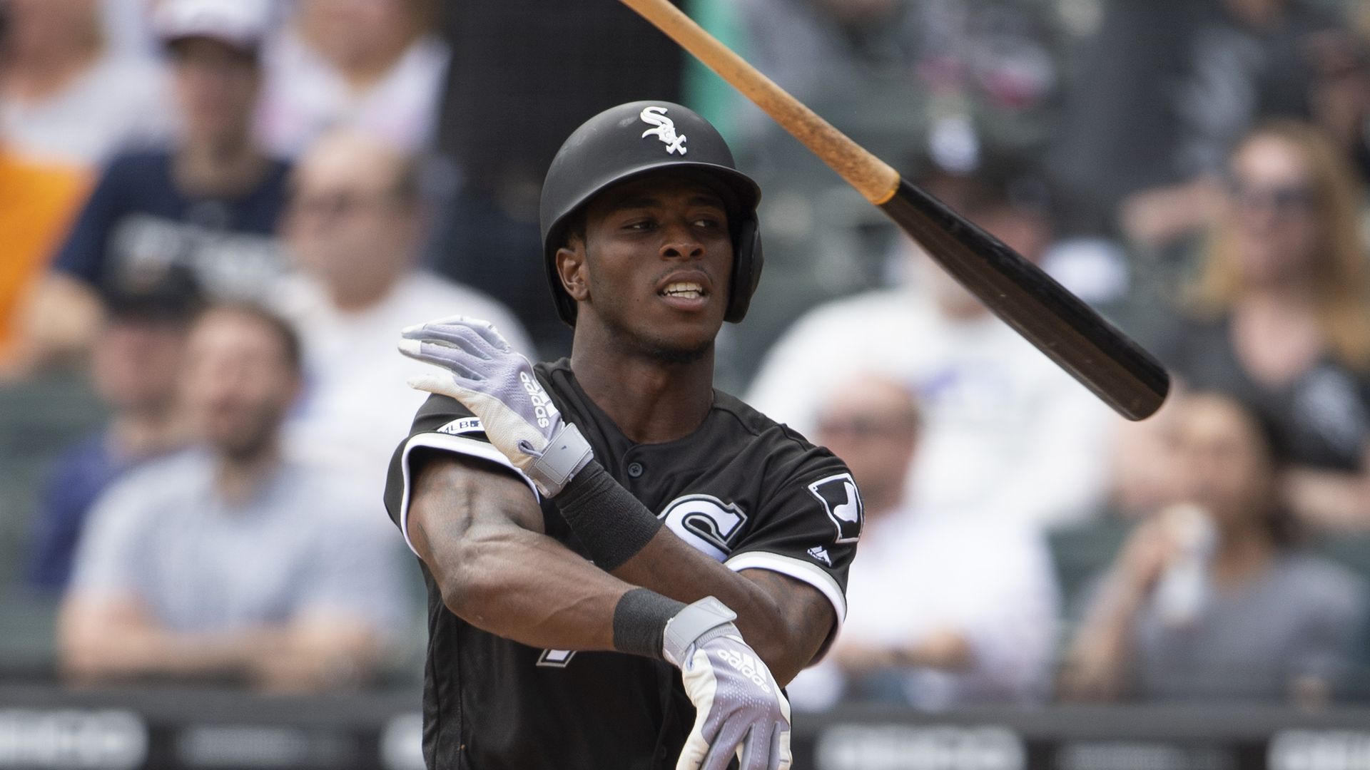 Photo of a baseball player throwing his bat