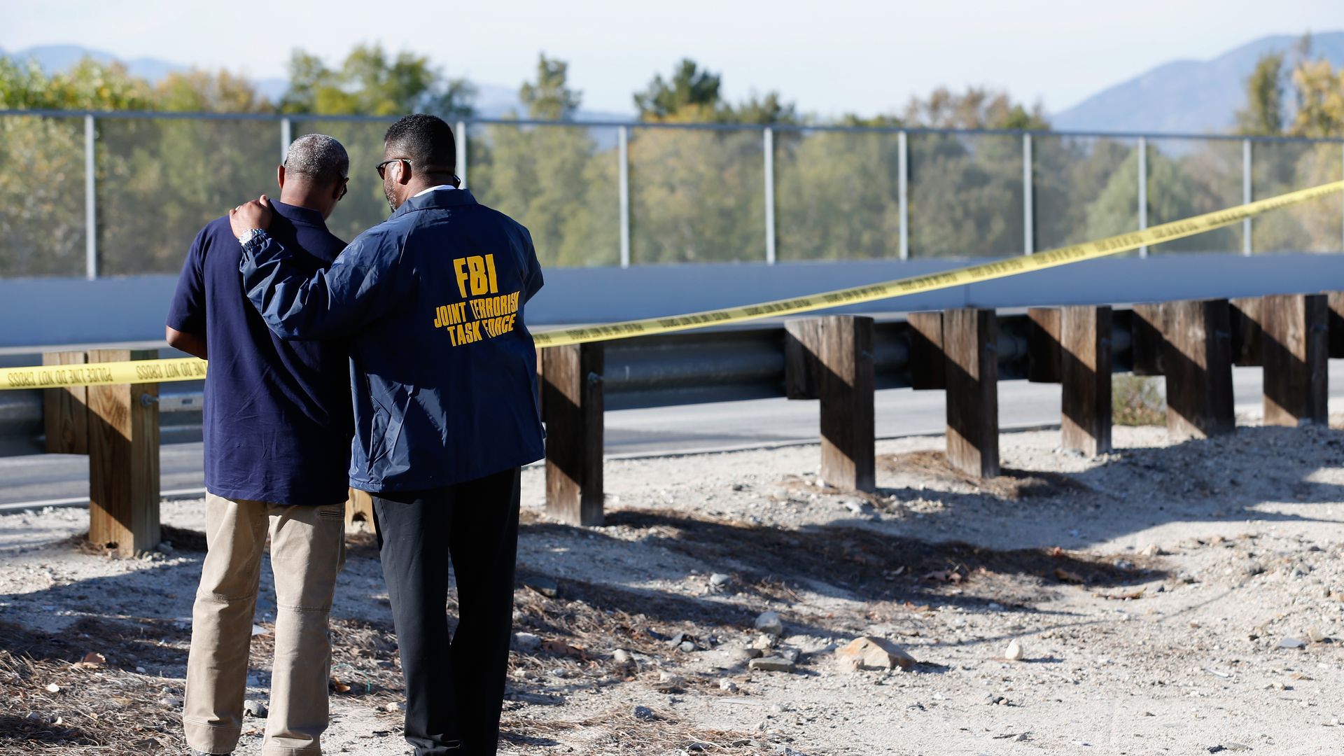 Members of the FBI Joint Terrorism Task Force stand outside of a press conference regarding the shooting that occurred at the Inland Regional Center