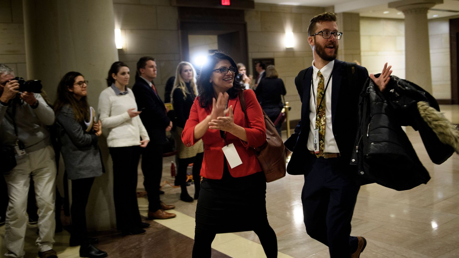 Rashida Tlaib walks through the halls in Congress