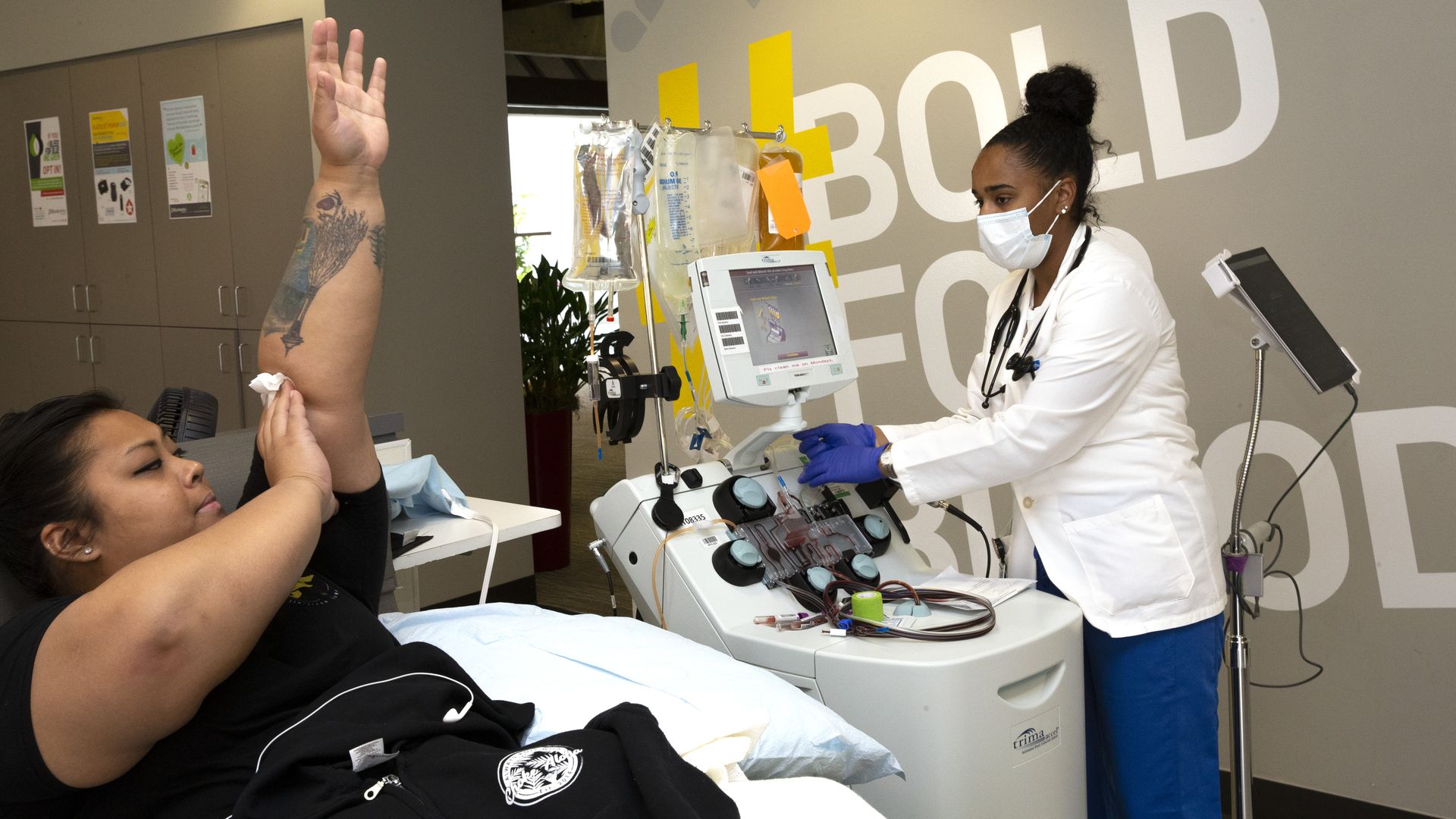 Photo of a woman giving convalescent plasma after recovering from COVID-19