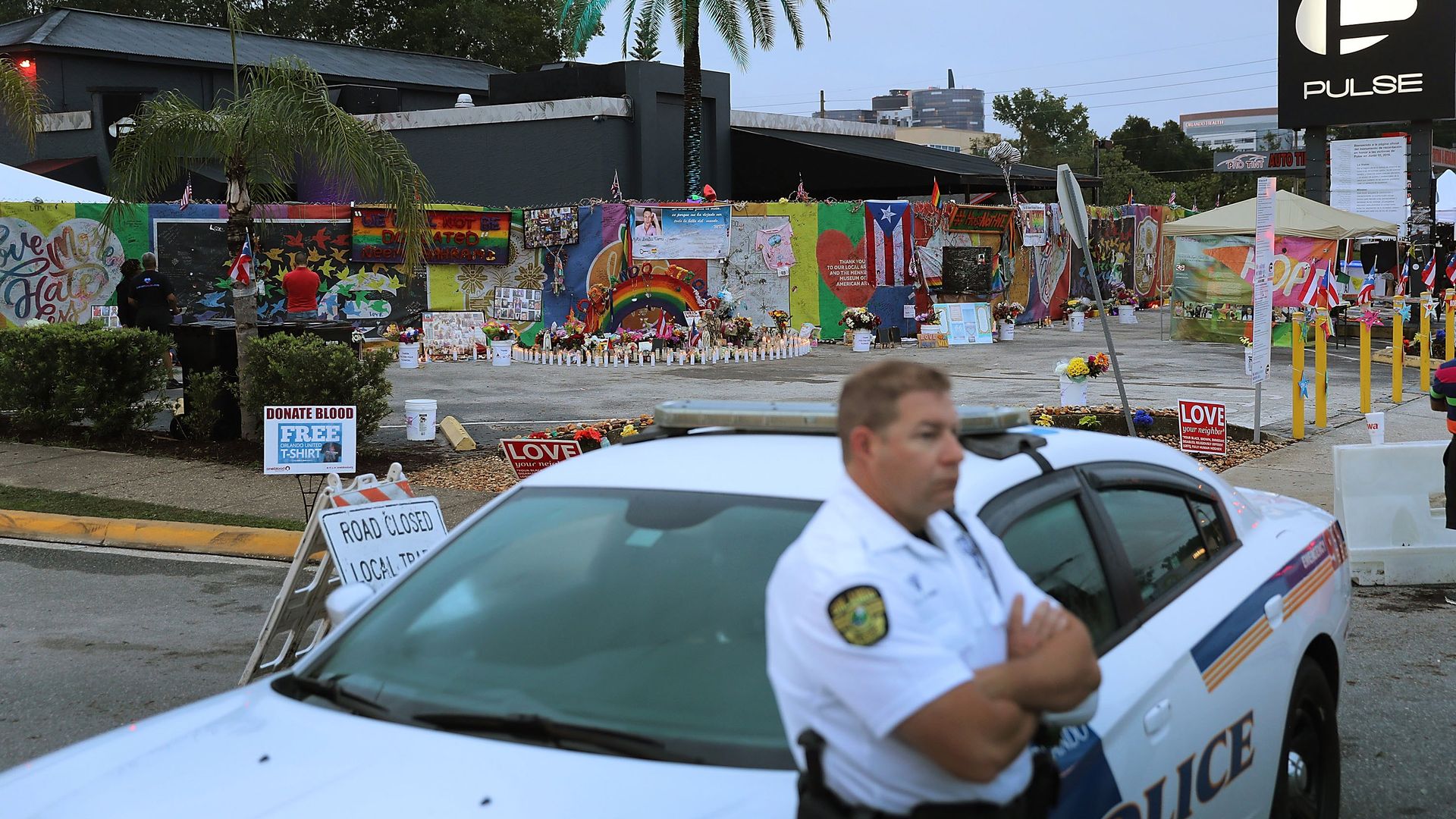 A police officer outside Pulse nightclub on the first anniversary of the mass shooting there