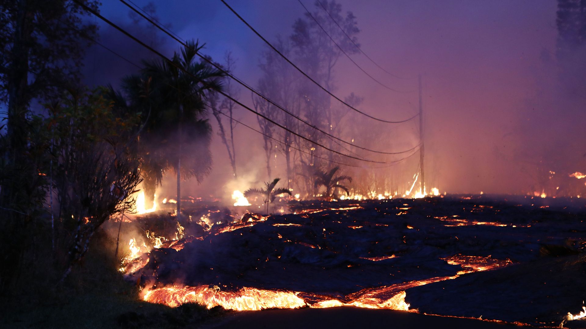 Lava from a Kilauea volcano fissure advances up a residential street in Leilani Estates, on Hawaii's Big Island last month in Pahoa, Hawaii.