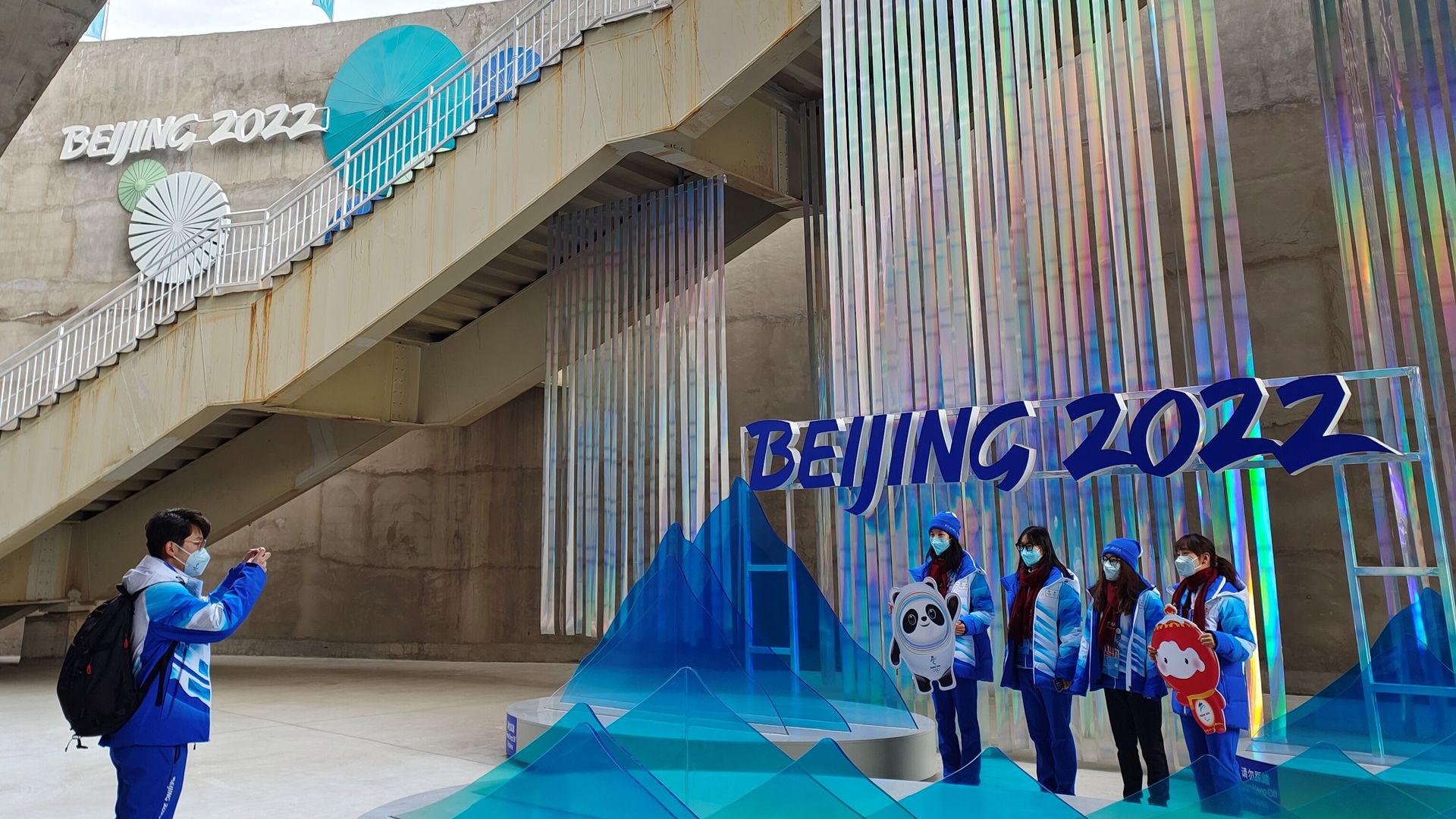 People posing near a Beijing 2022 sign in Beijing in January.