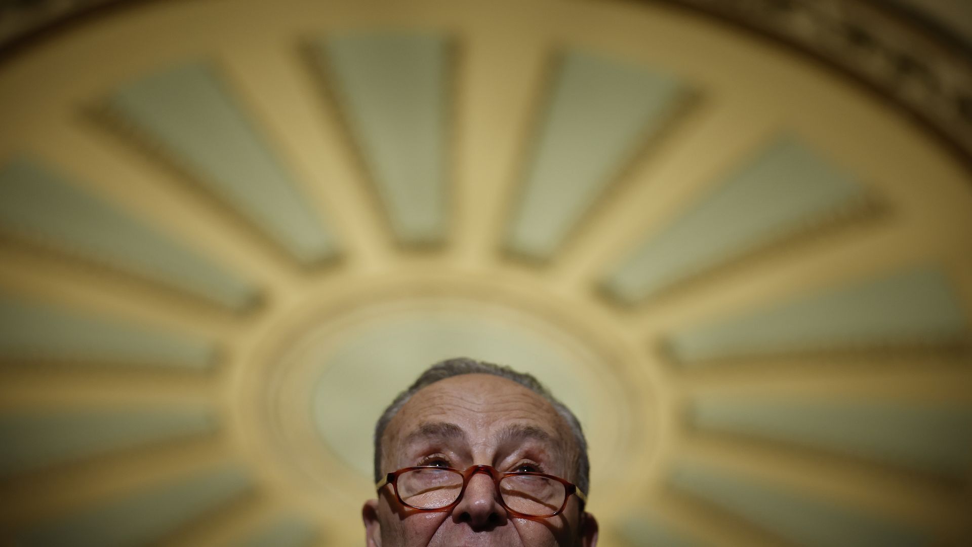 Senate Majority Leader Chuck Schumer is seen addressing reporters.