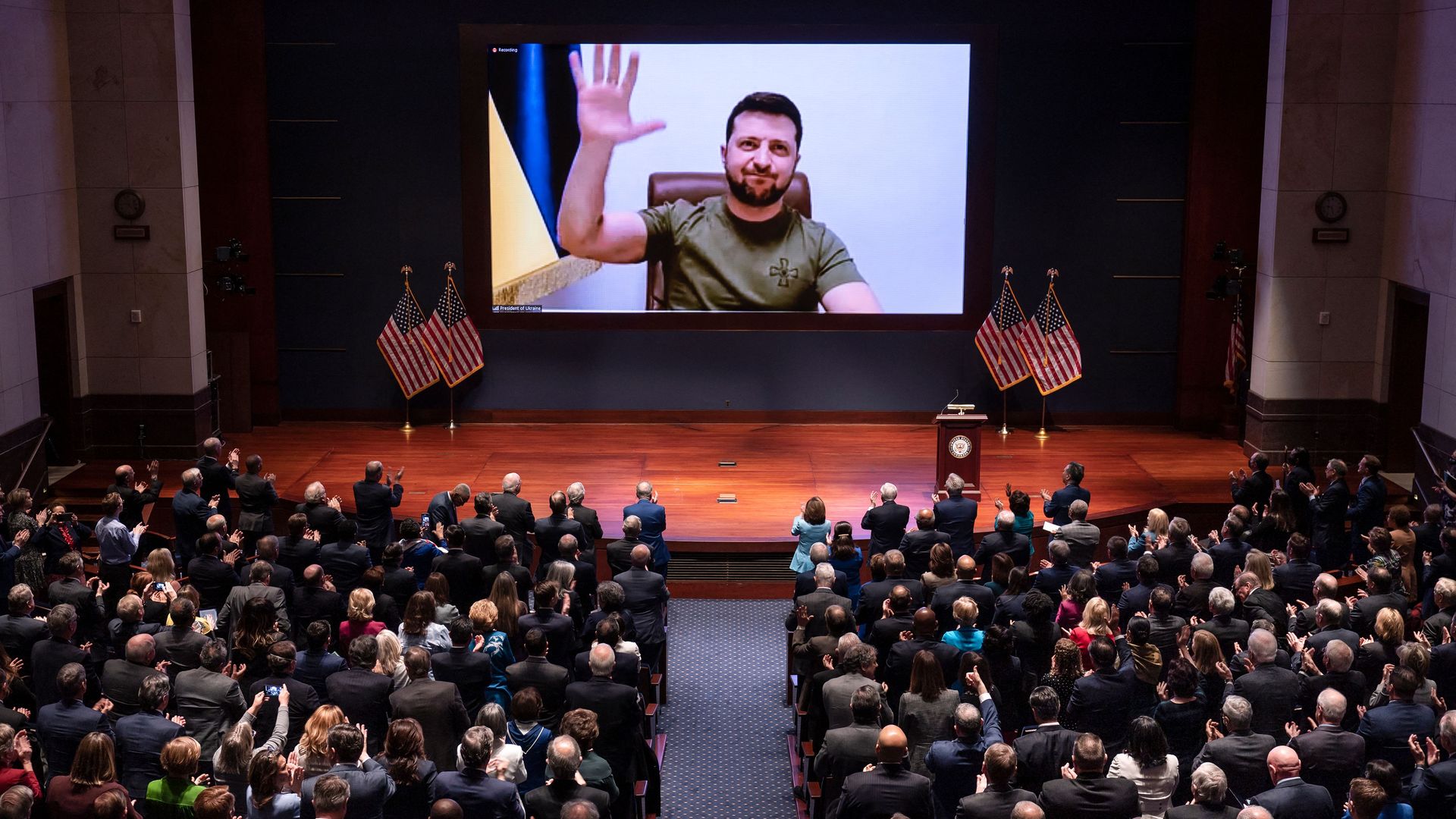 President Zelensky is seen waving to Congress during his virtual address on Wednesday.