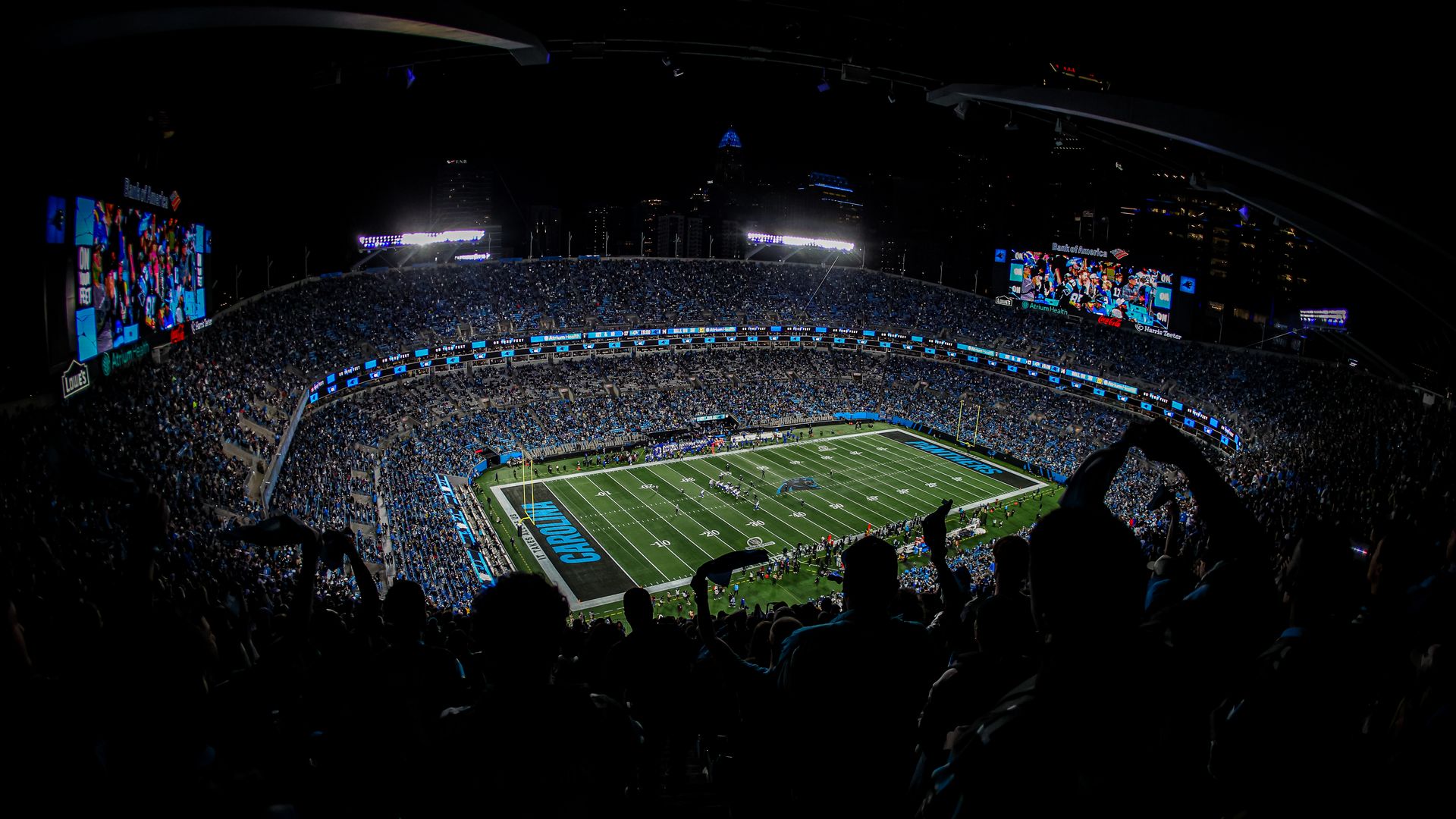 Packed Bank of America Stadium at night for a Panthers game.
