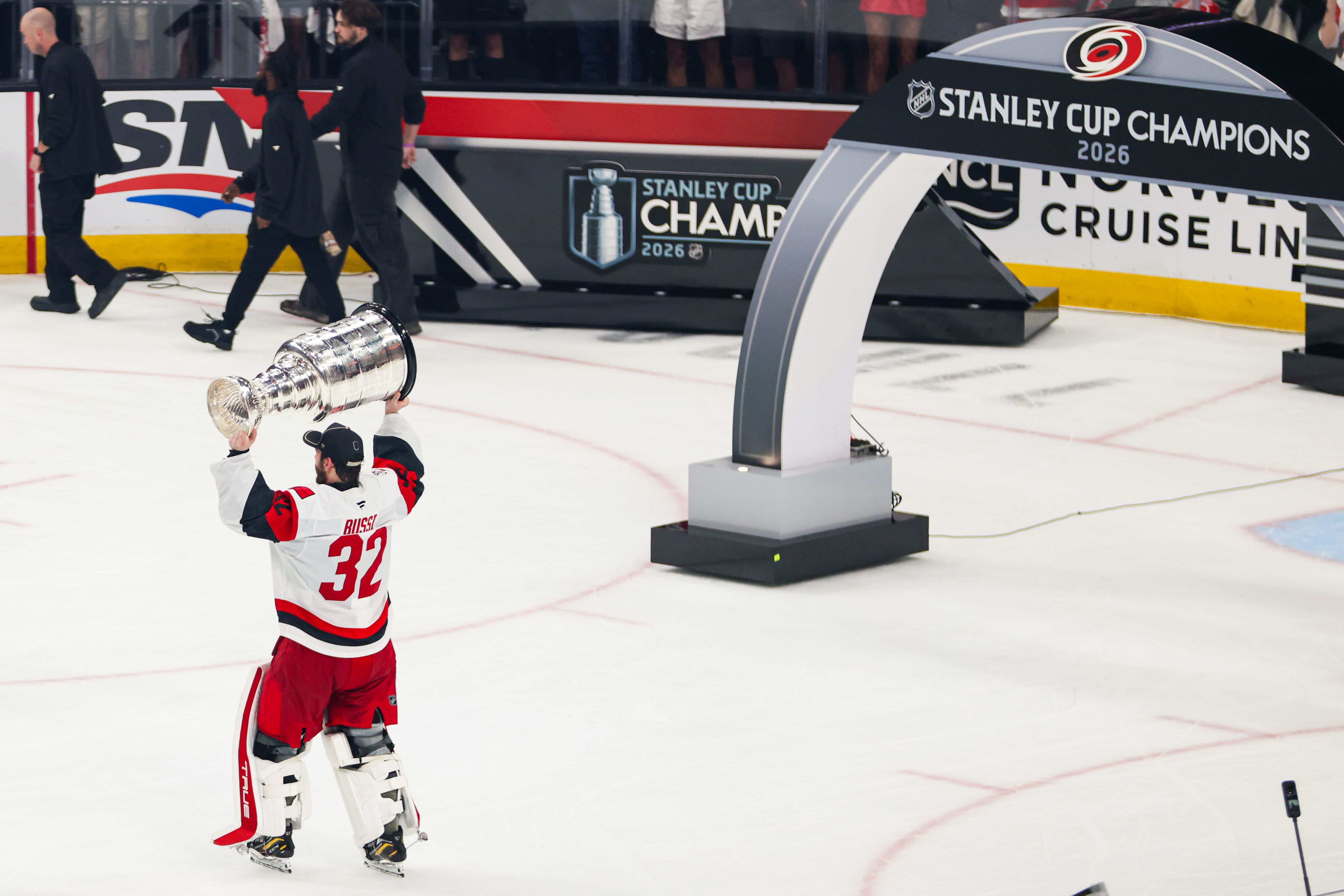 :Brandon Bussi #32 of the Carolina Hurricanes lifts the Stanley Cup.