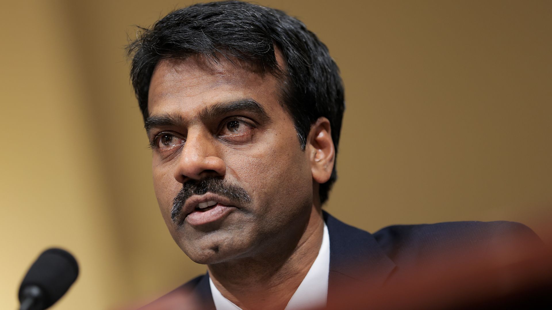 Madhu Gottumukkala, then-acting director of the Cybersecurity and Infrastructure Security Agency, sitting in front of a microphone while testifying during a congressional hearing