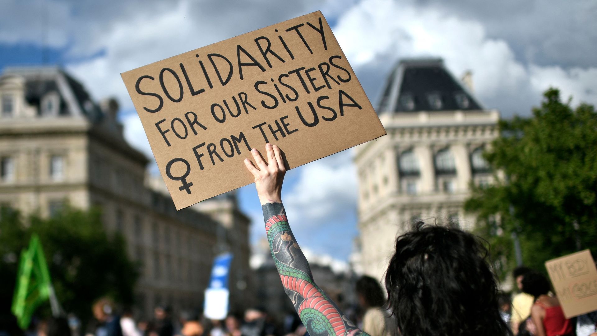A protestor holds a sign during a rally in support of worldwide abortion rights in Paris,