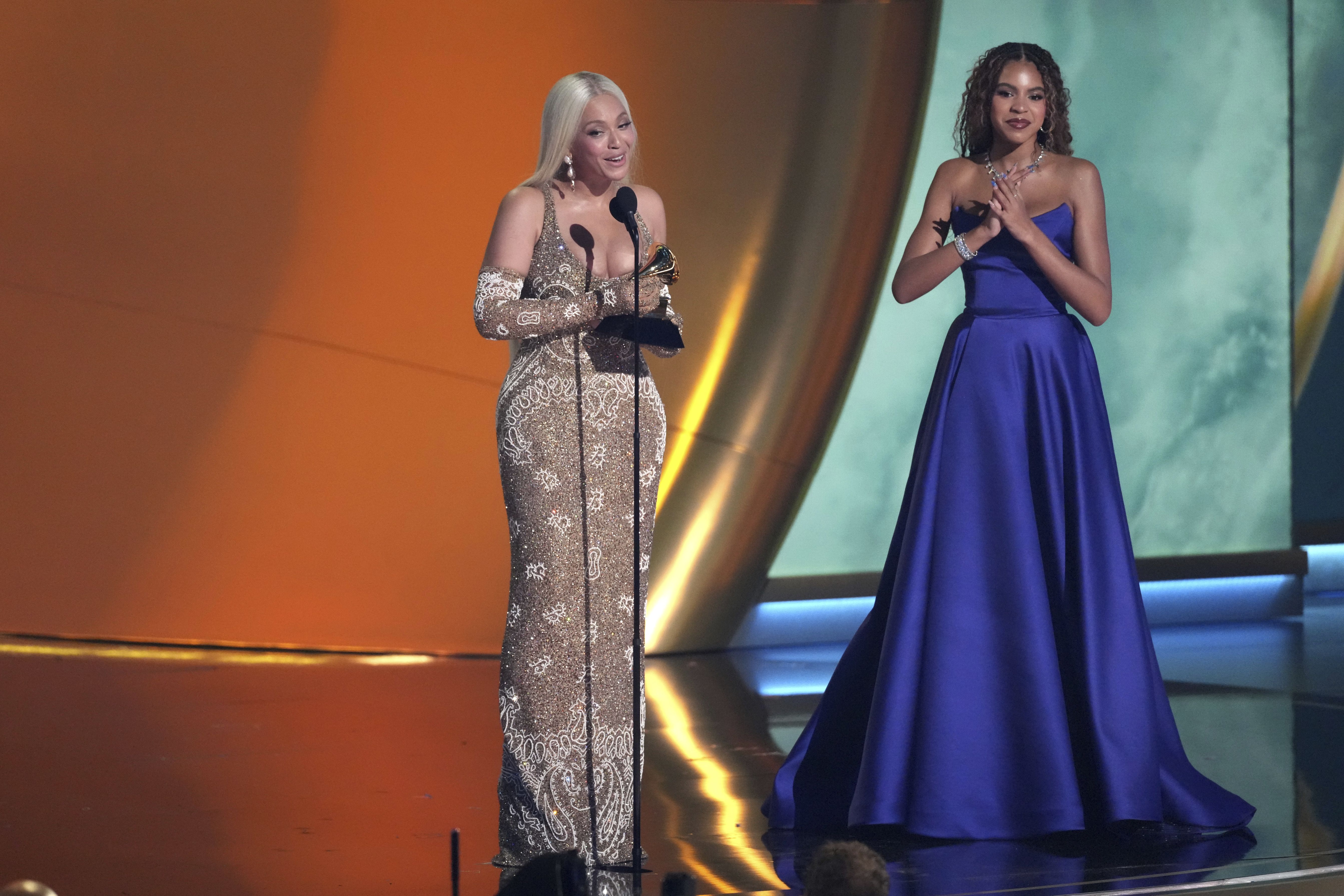 Beyonce accepts the award for album of the year for "COWBOY CARTER during the 67th annual Grammy Awards on Sunday, Feb. 2, 2025, in Los Angeles. Blue Ivy Carter looks on from right.(AP Photo/Chris Pizzello)