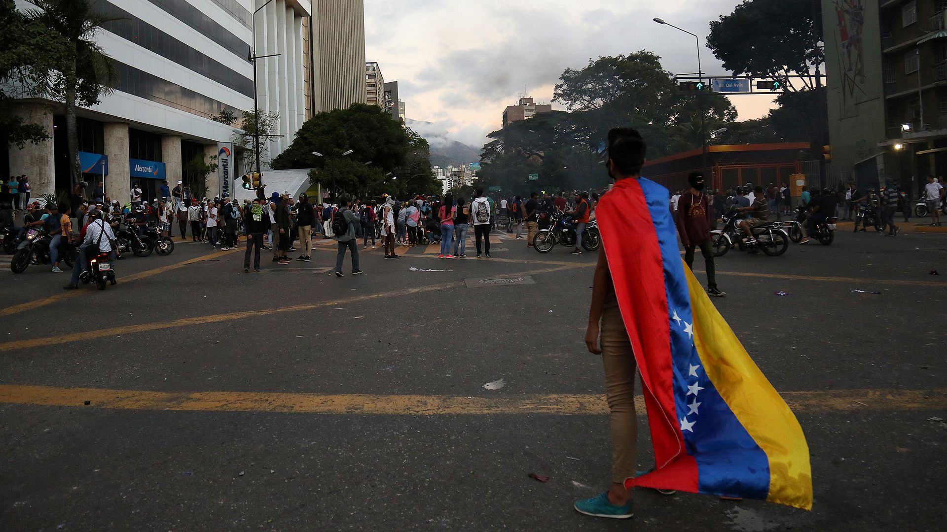 A man carries a Venezuelan flag during a protest against the government of Nicolas Maduro after opposition leader and head of the National Assembly Juan Guaido declared self interim president