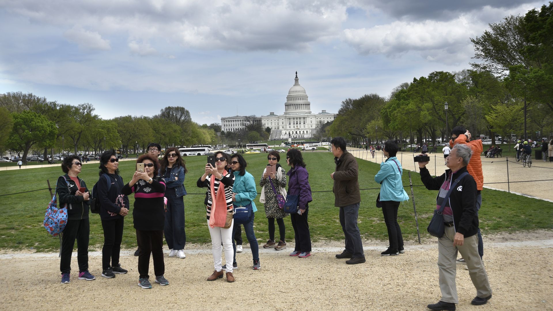 Chinese tourists taking pictures on the National Mall