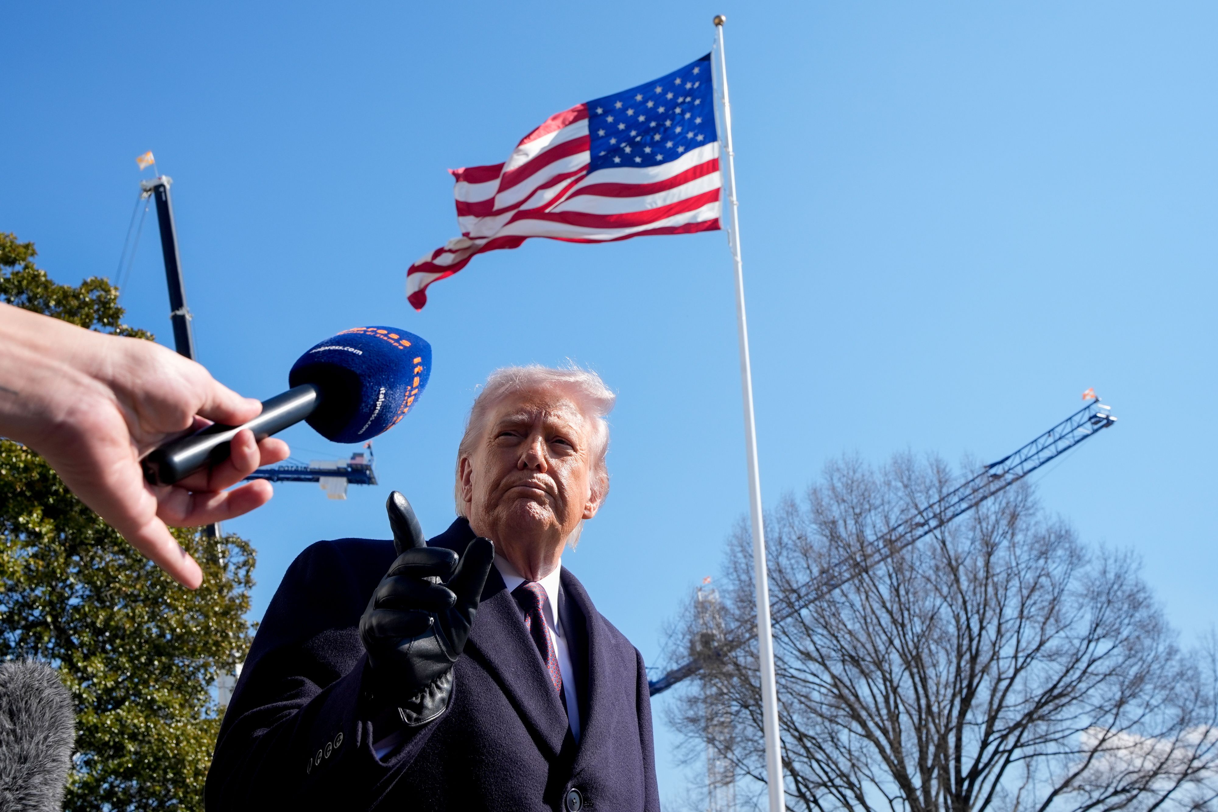 President Trump speaks to the media before leaving the White House for Texas on Friday. Photo: Yuri Gripas/Abaca/Bloomberg via Getty Images